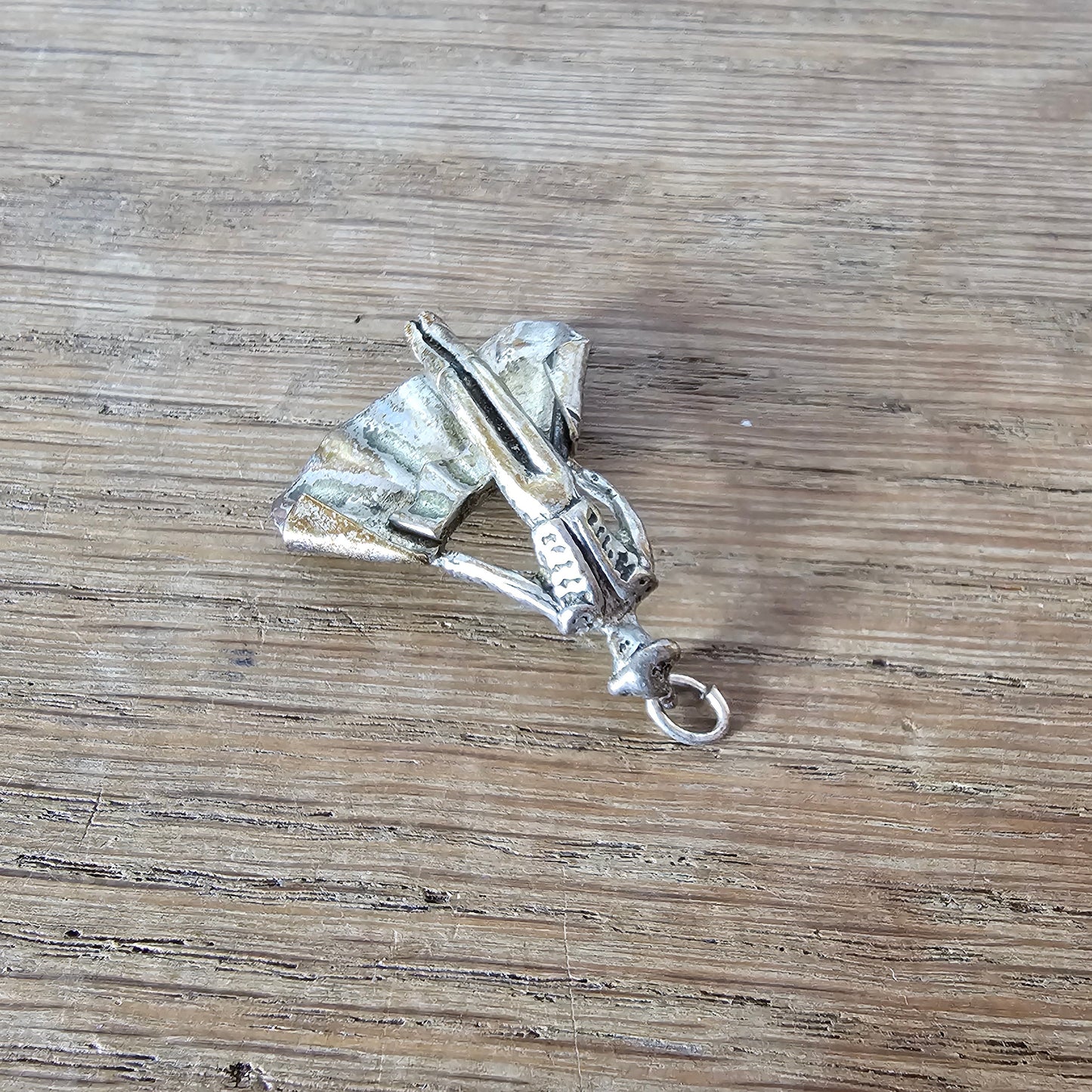 Mid-century silver-tone figural matador charm
