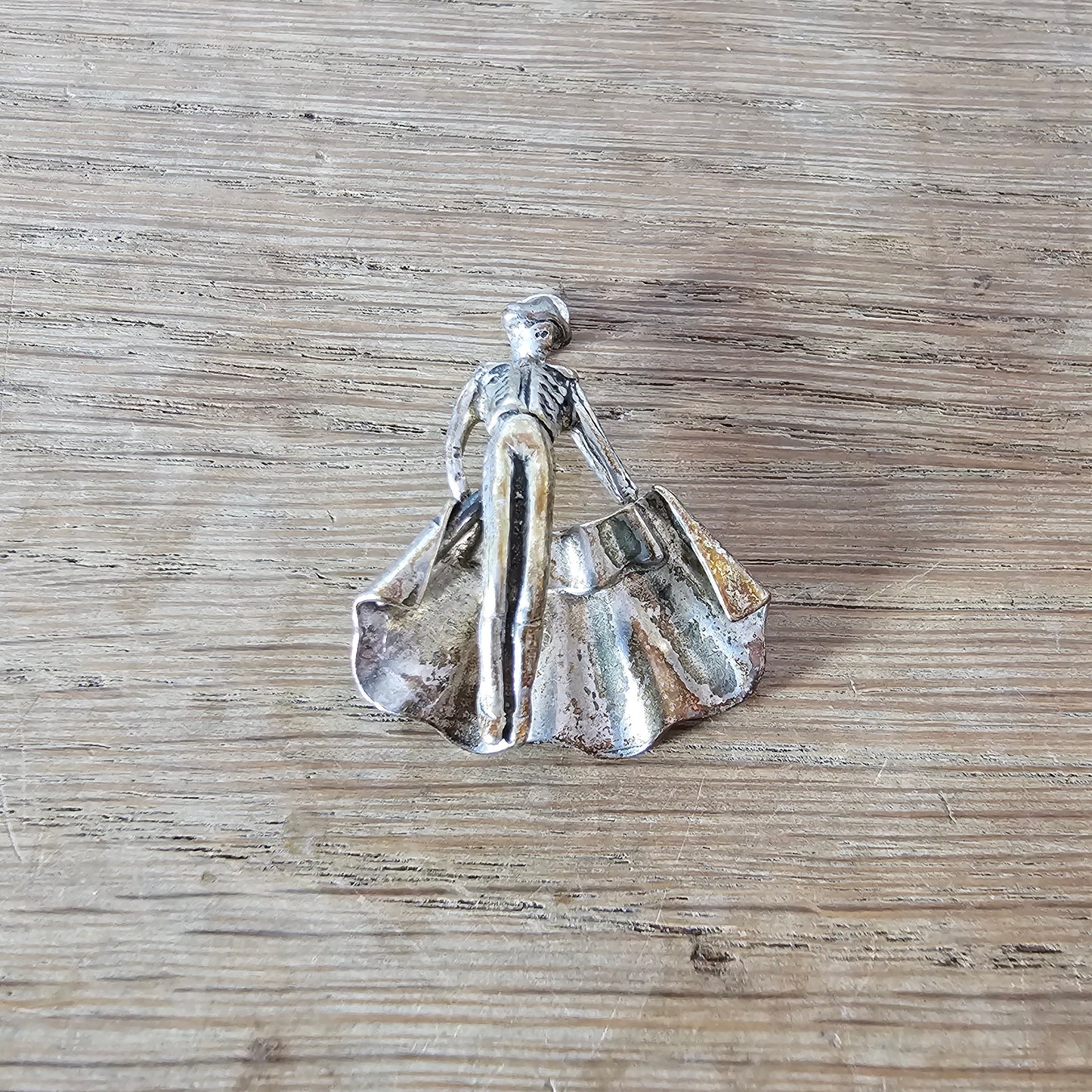 Mid-century silver-tone figural matador charm