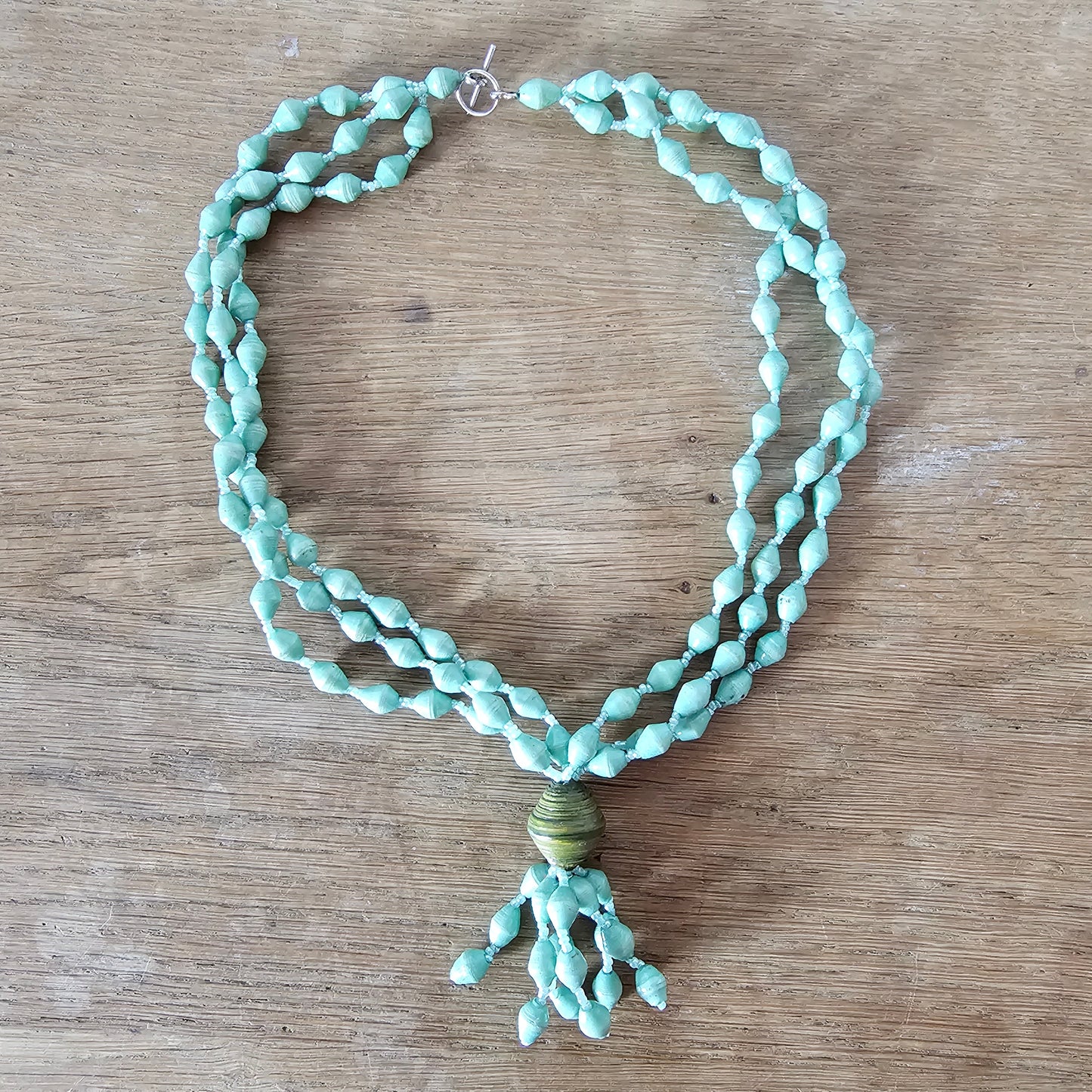 1970s seafoam green paper bead triple-strand necklace with tassel drop