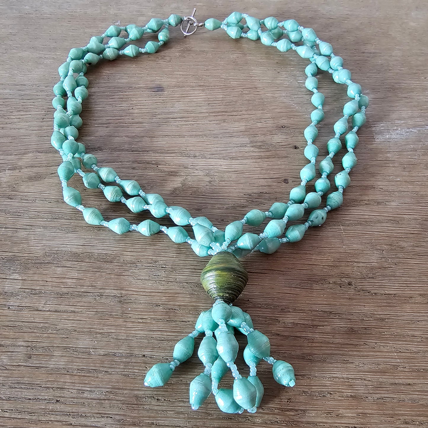 1970s seafoam green paper bead triple-strand necklace with tassel drop