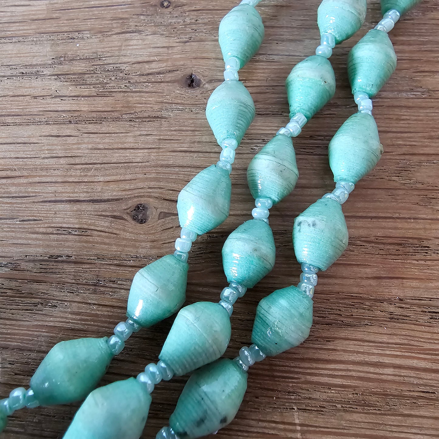 1970s seafoam green paper bead triple-strand necklace with tassel drop