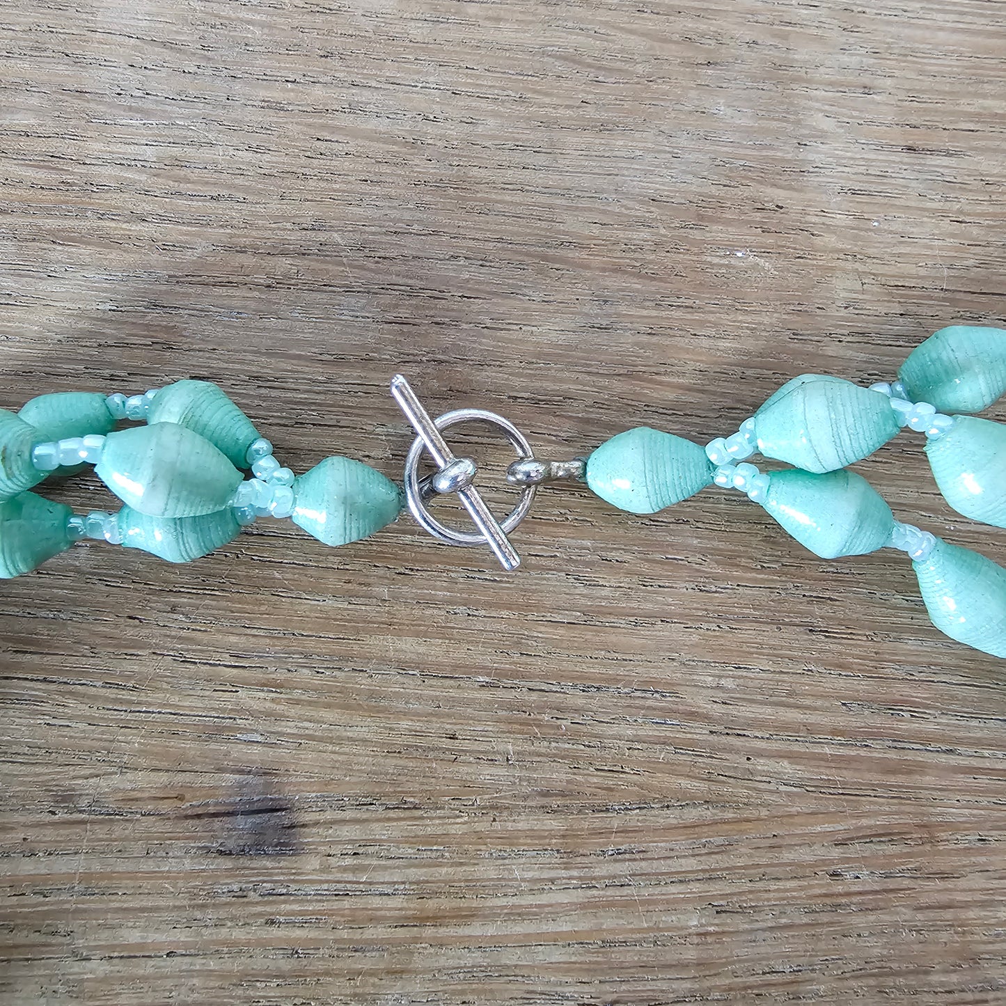 1970s seafoam green paper bead triple-strand necklace with tassel drop