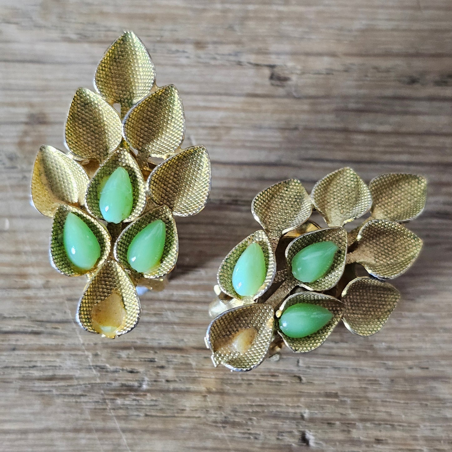 1960s Austrian gold-tone leaf & green glass cabochon clip-on earrings
