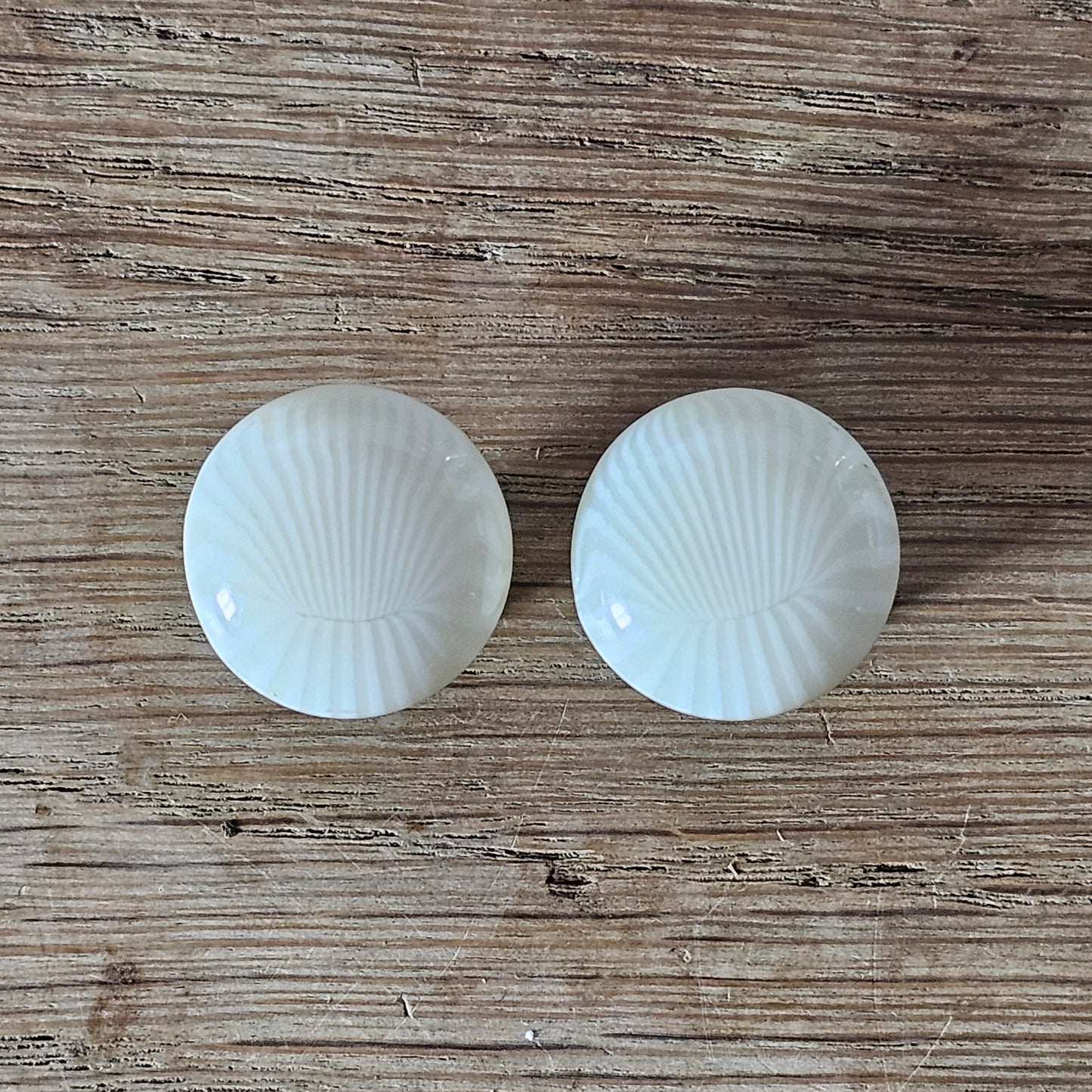 1960s ivory sunburst textured plastic button clip-on earrings