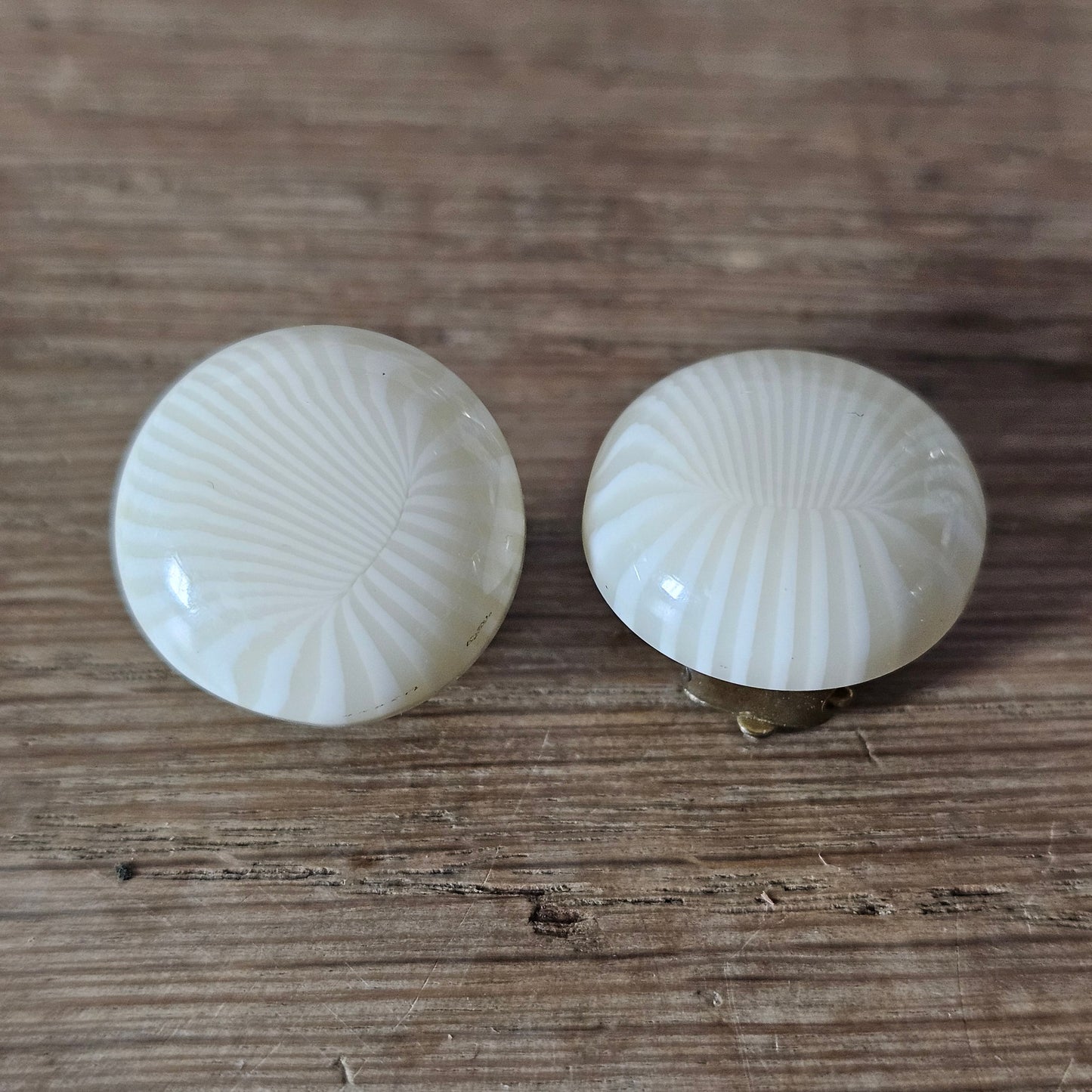 1960s ivory sunburst textured plastic button clip-on earrings