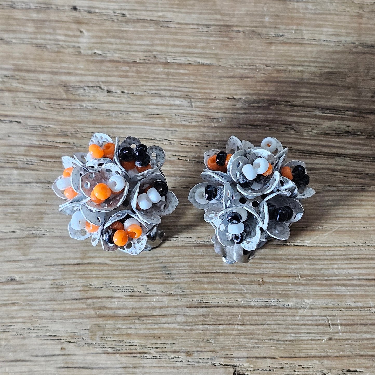 1960s articulated white, orange & black seed bead cluster clip-on earrings