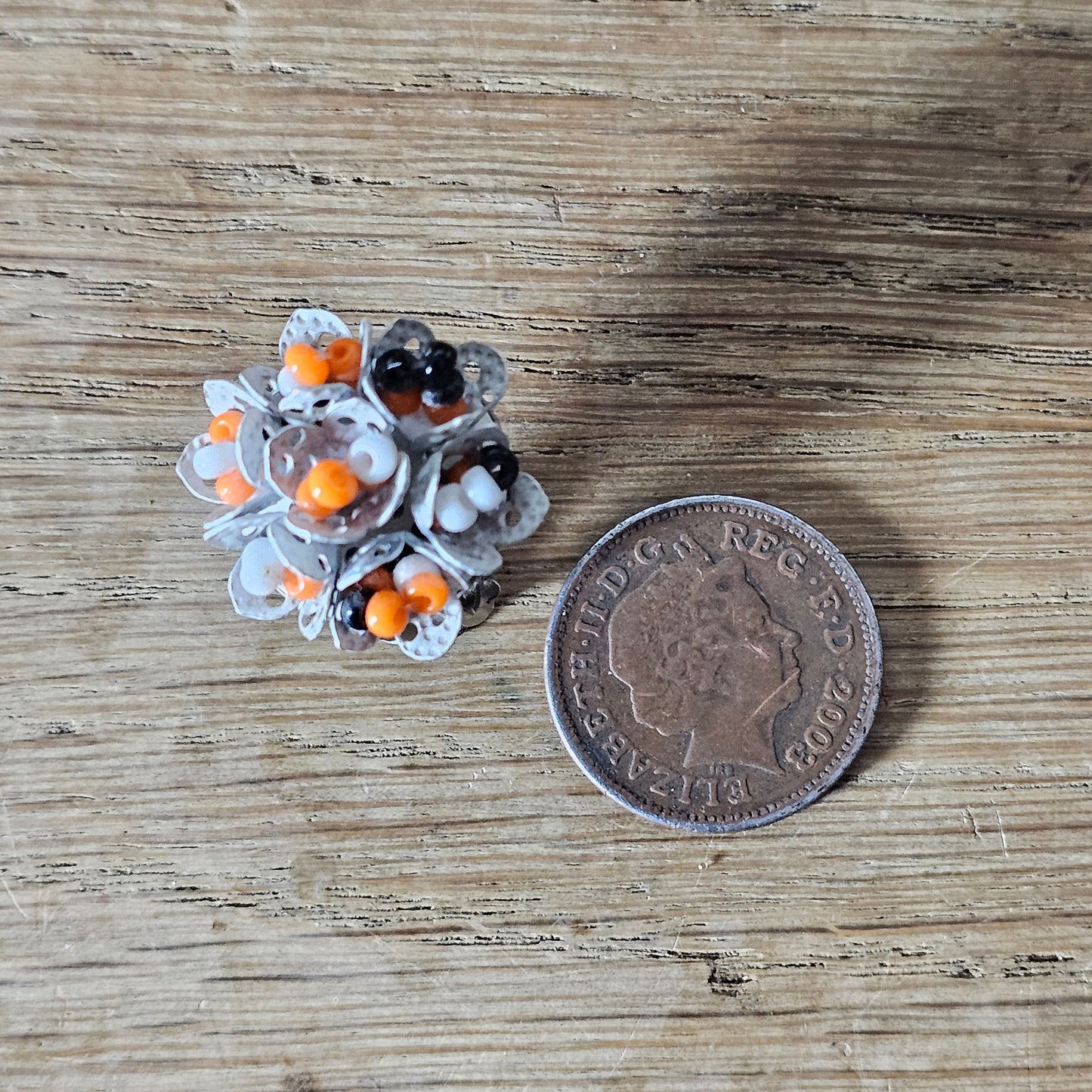 1960s articulated white, orange & black seed bead cluster clip-on earrings