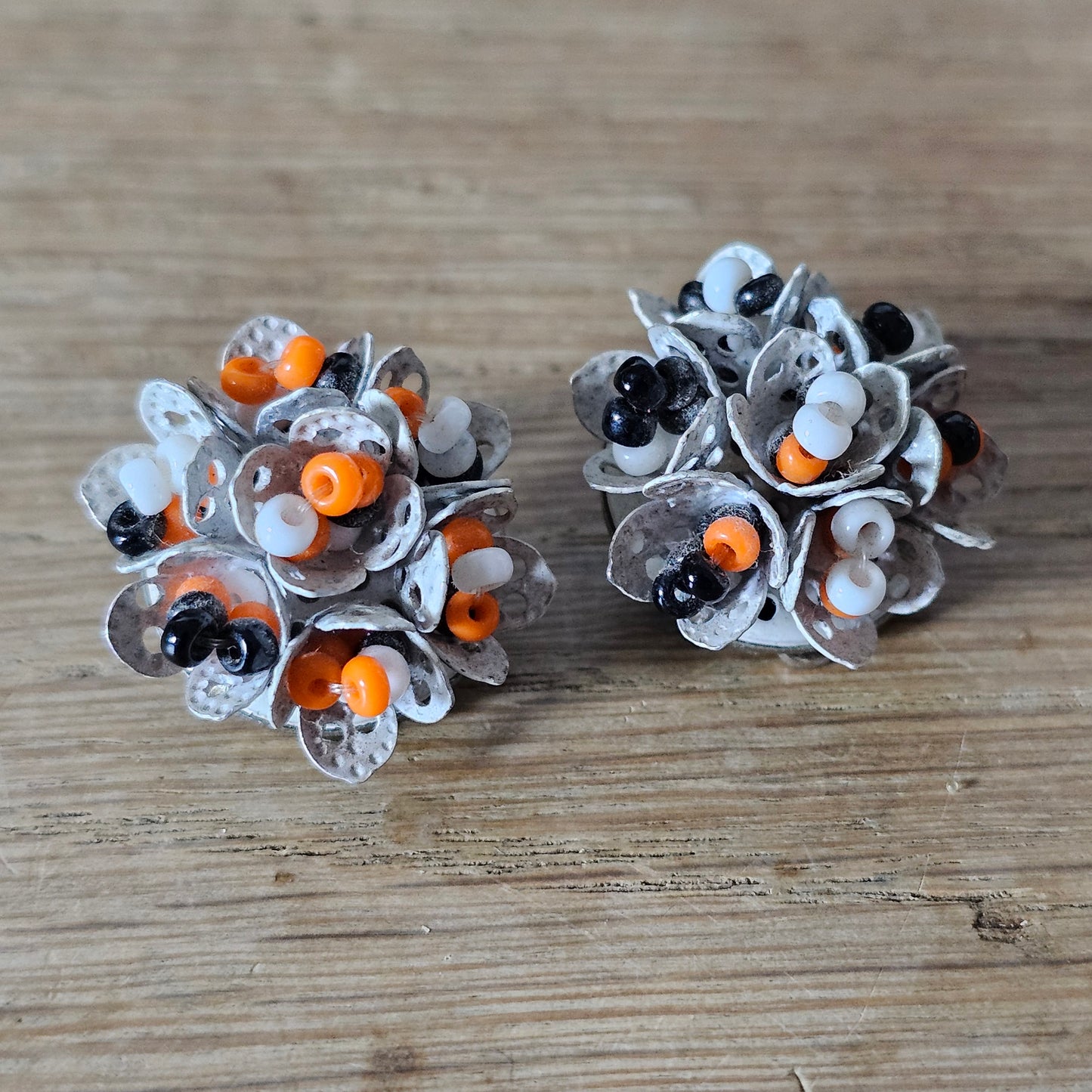 1960s articulated white, orange & black seed bead cluster clip-on earrings