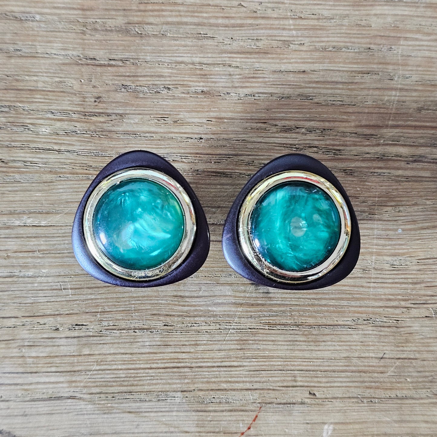 1980s black & gold-tone clip-on earrings with iridescent green cabochon centre