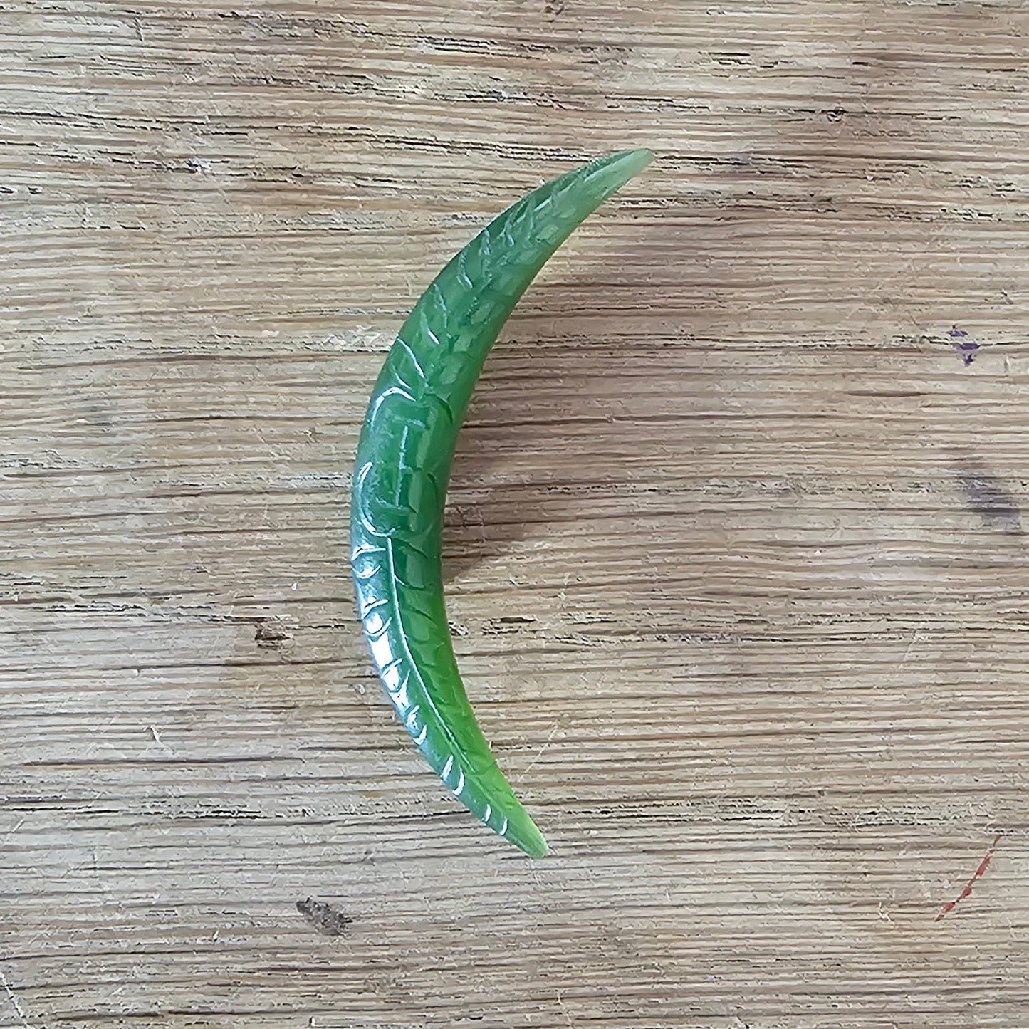 Home-made brooch using vintage carved jade crescent