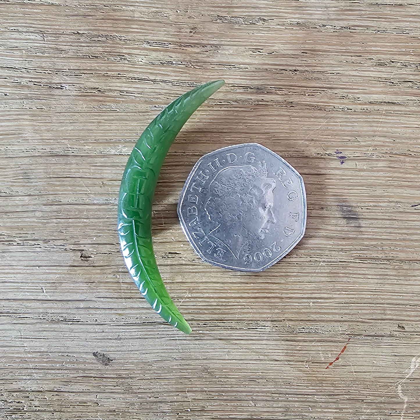 Home-made brooch using vintage carved jade crescent