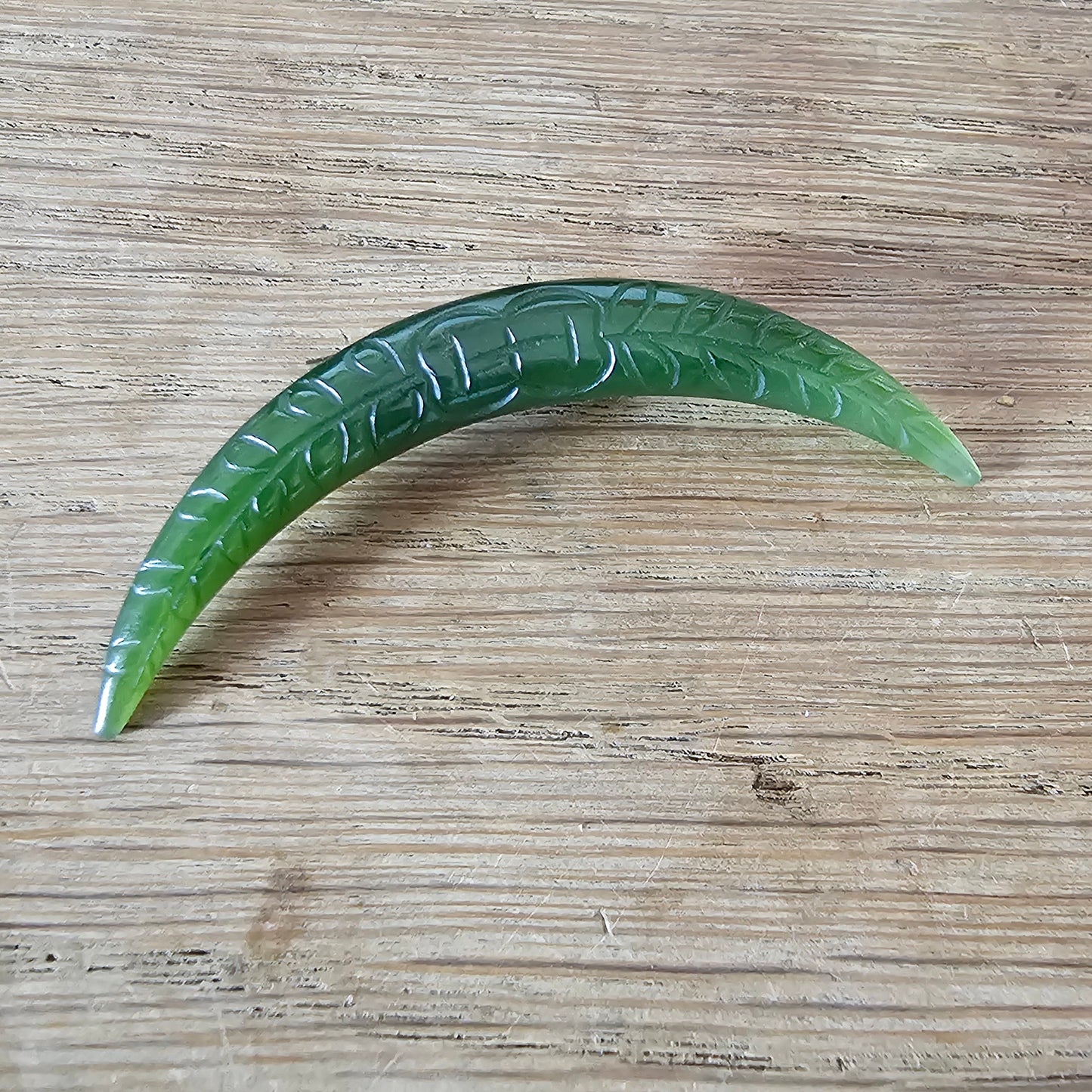 Home-made brooch using vintage carved jade crescent