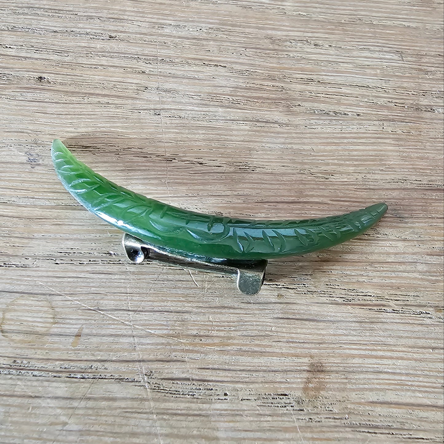 Home-made brooch using vintage carved jade crescent