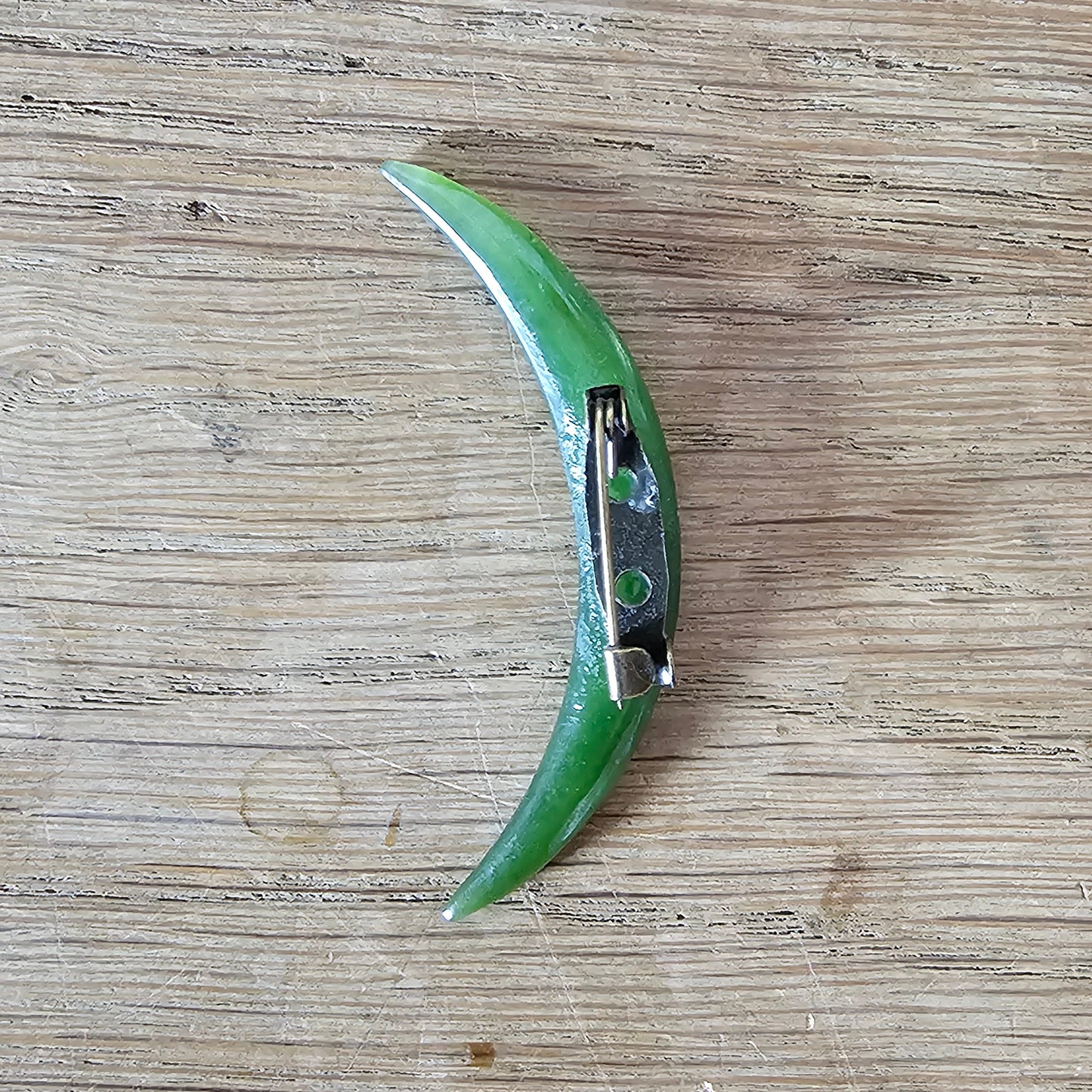 Home-made brooch using vintage carved jade crescent