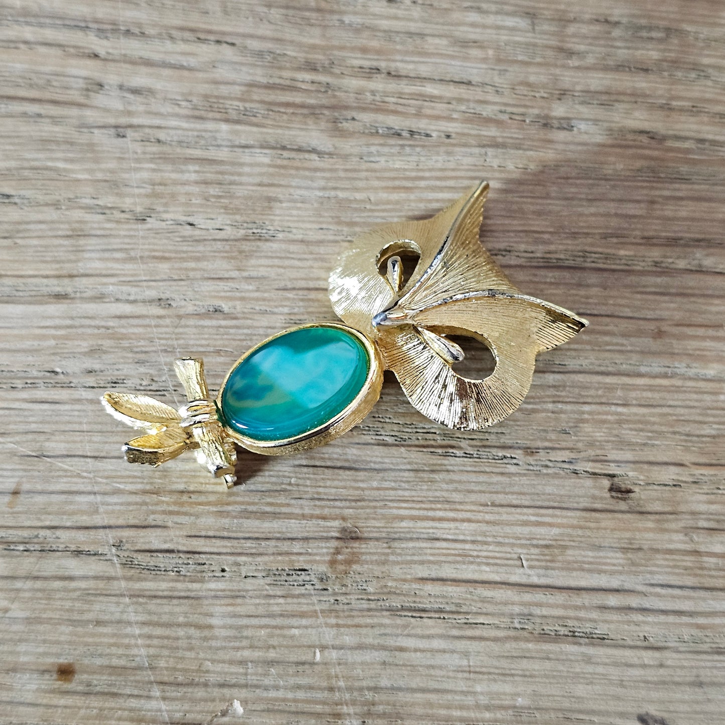 1980s Liz Clairborne modernist-style gold-tone owl brooch with green cabochon belly