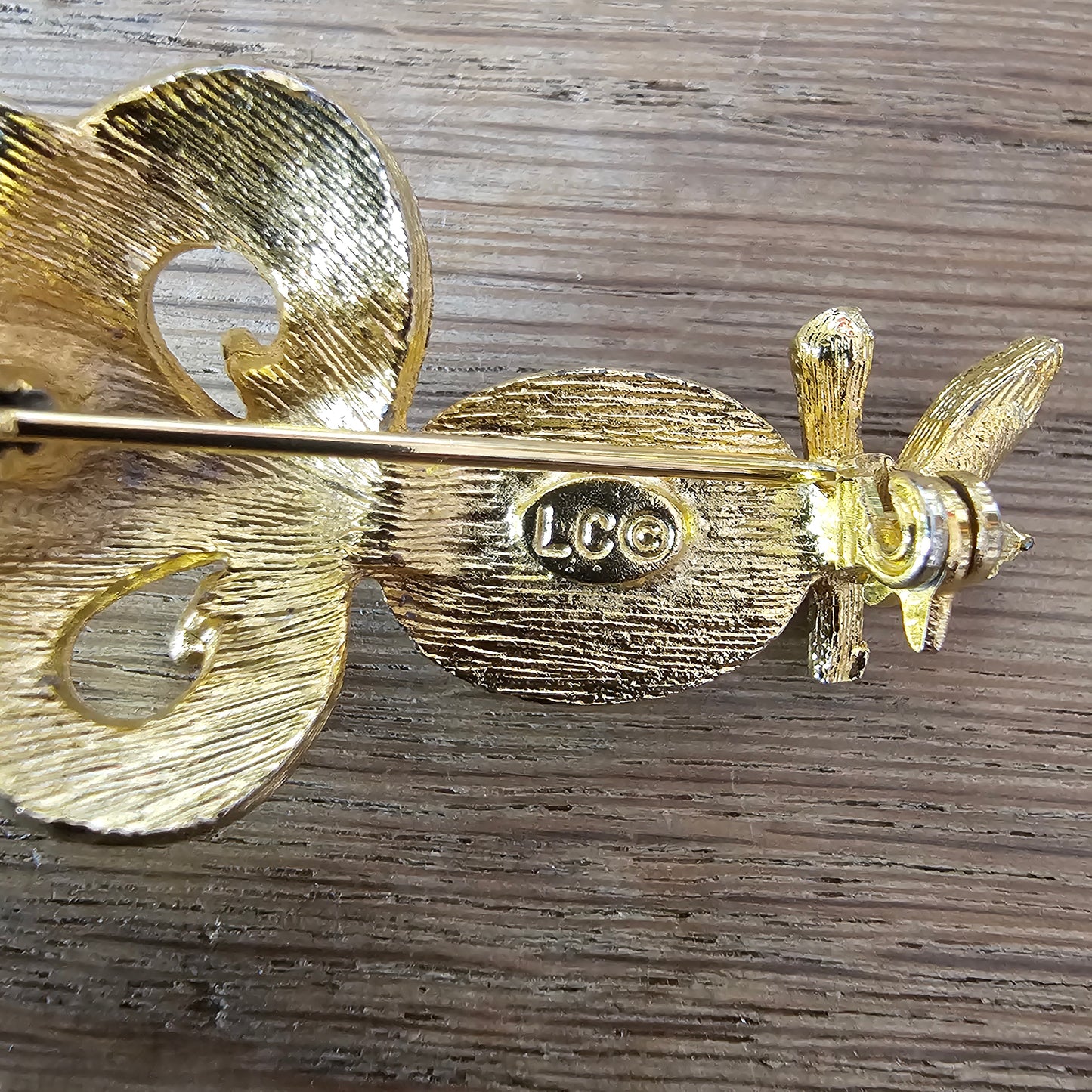 1980s Liz Clairborne modernist-style gold-tone owl brooch with green cabochon belly