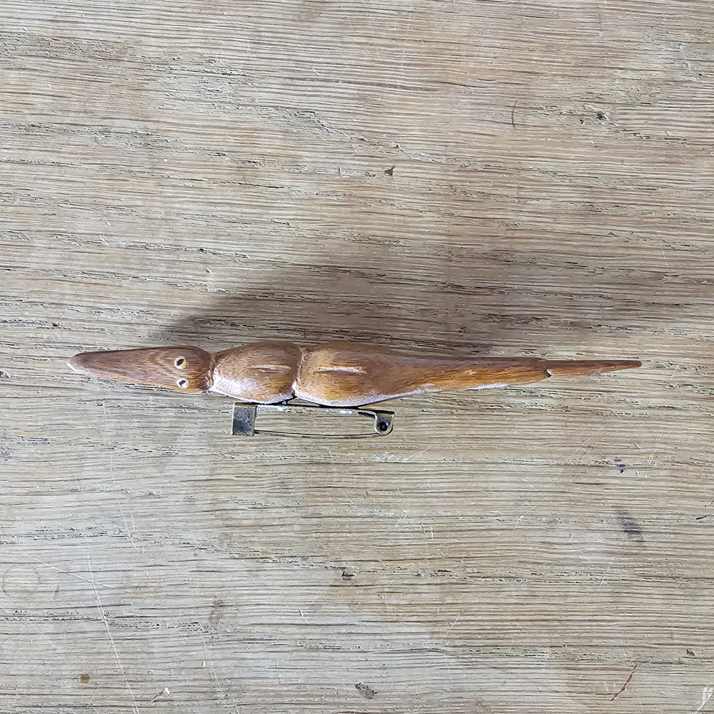 Home-made brooch using vintage wooden crocodile figurine