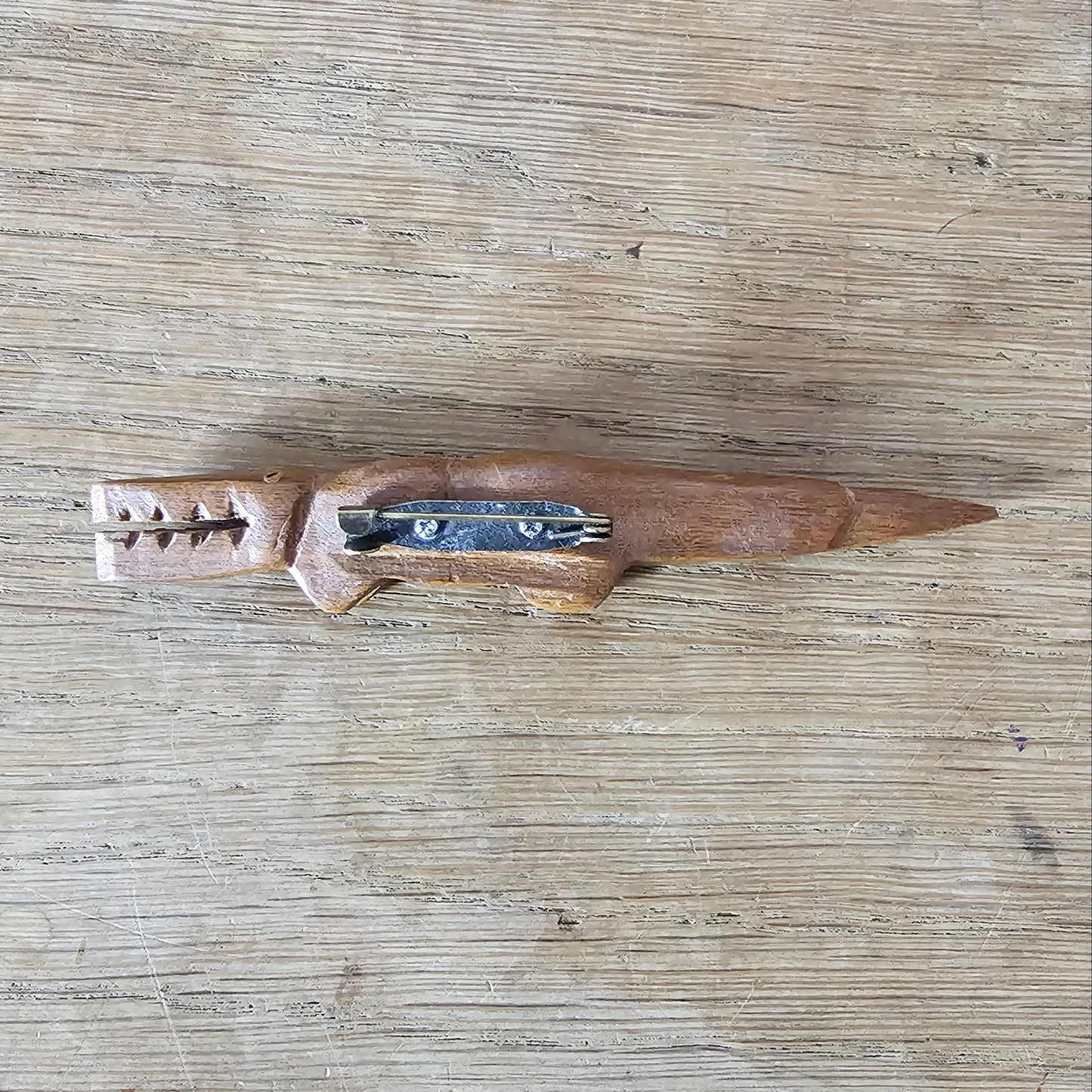 Home-made brooch using vintage wooden crocodile figurine
