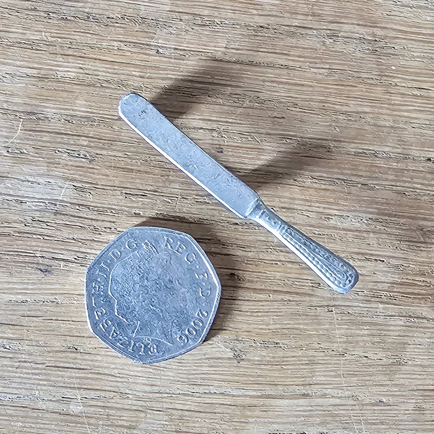 Home-made brooch using vintage minature butter knife