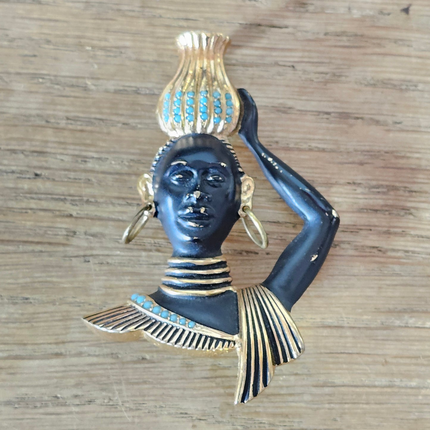 Mid-century gold-tone figural tribal bust brooch with turquoise seed bead accents