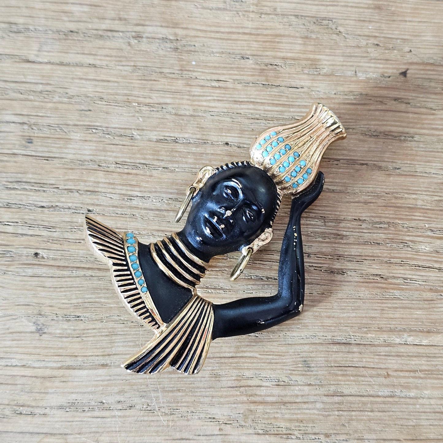 Mid-century gold-tone figural tribal bust brooch with turquoise seed bead accents