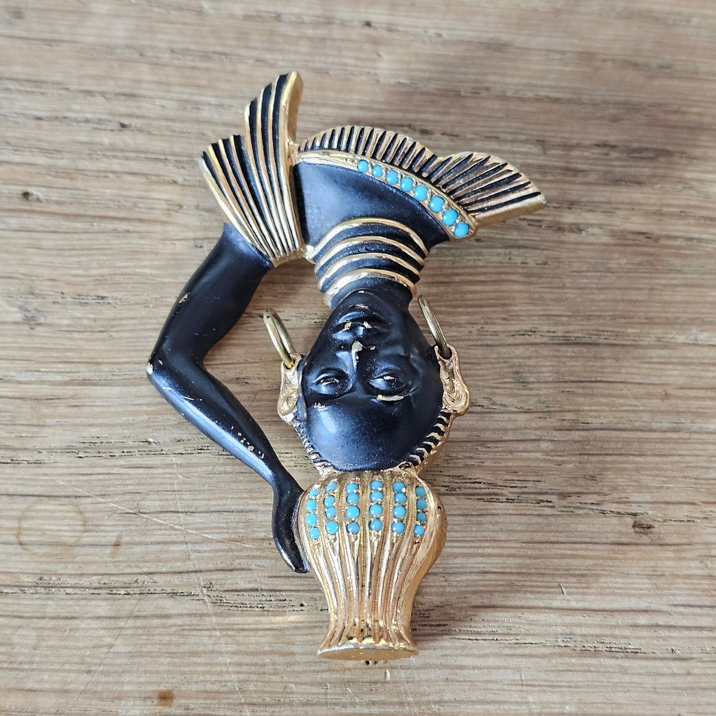 Mid-century gold-tone figural tribal bust brooch with turquoise seed bead accents