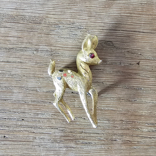1950s gold-tone fawn brooch with red rhinestone eye