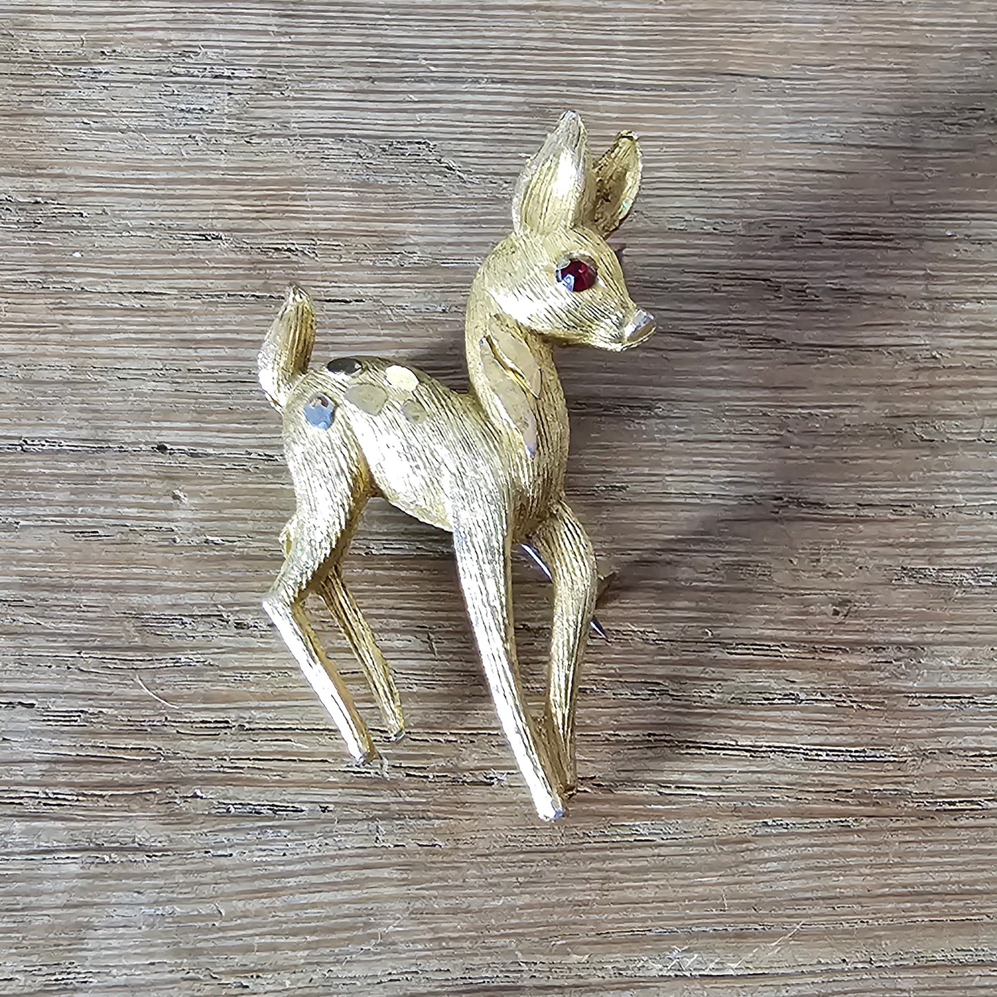 1950s gold-tone fawn brooch with red rhinestone eye