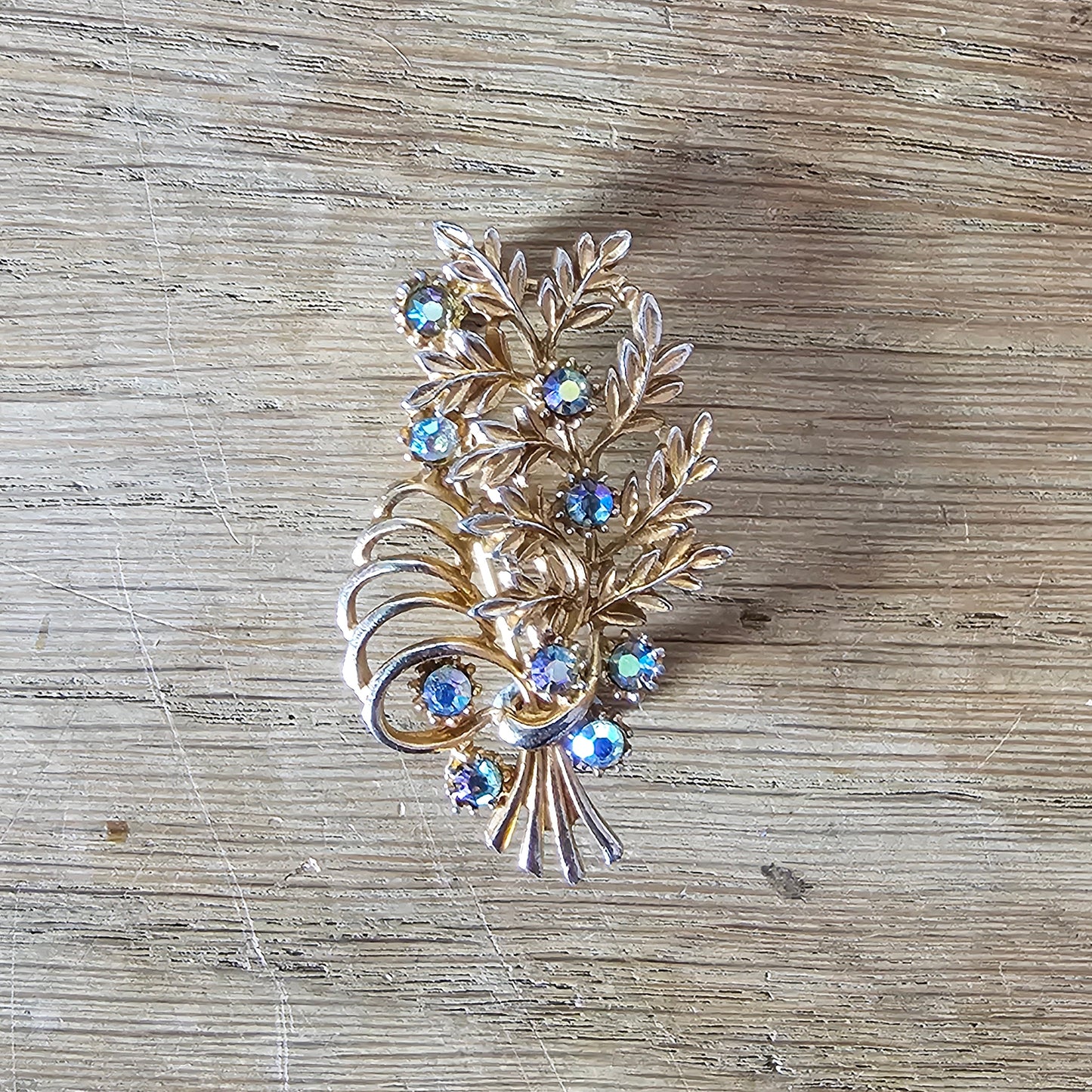 1960s copper-tone floral spray brooch with Aurora Borealis rhinestones