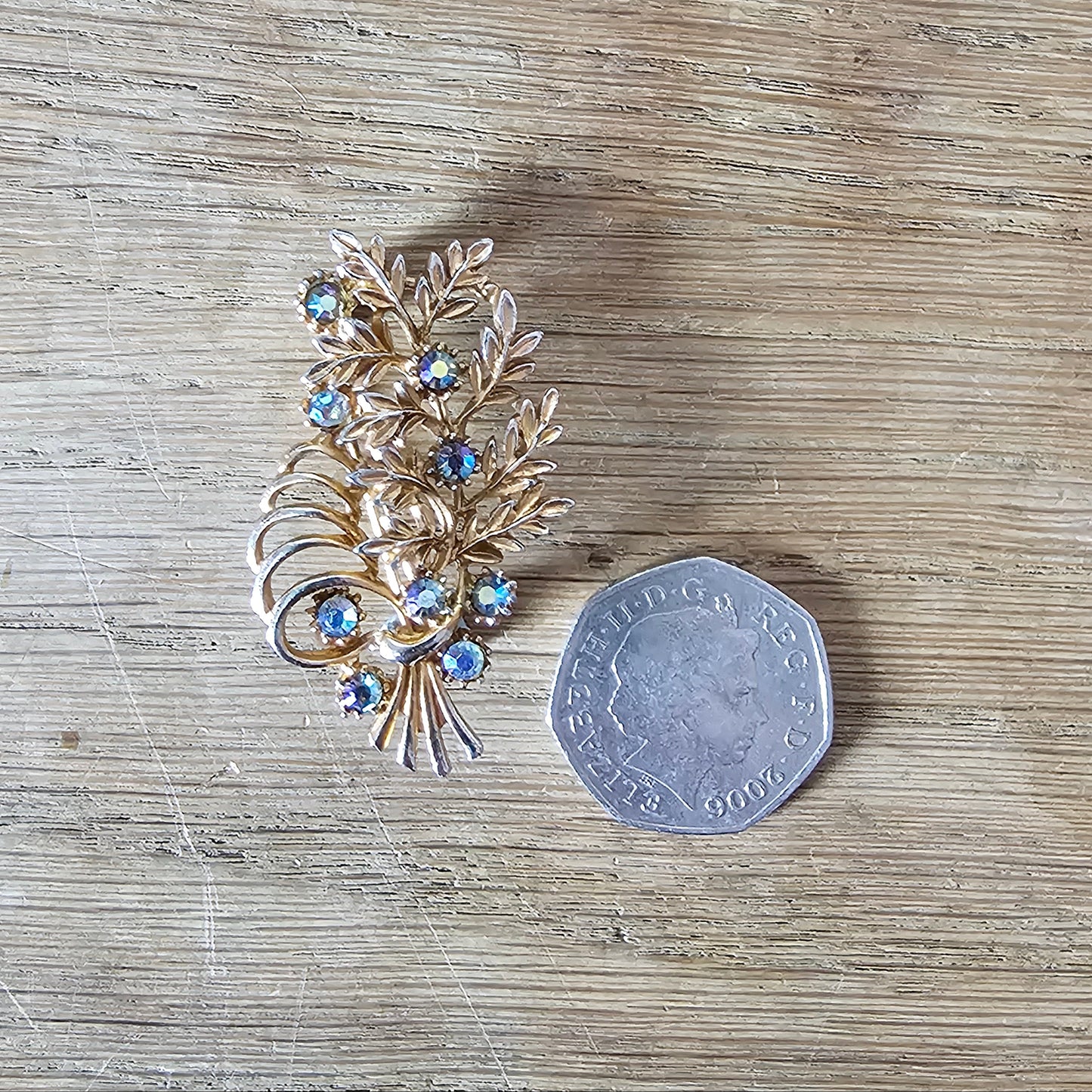 1960s copper-tone floral spray brooch with Aurora Borealis rhinestones