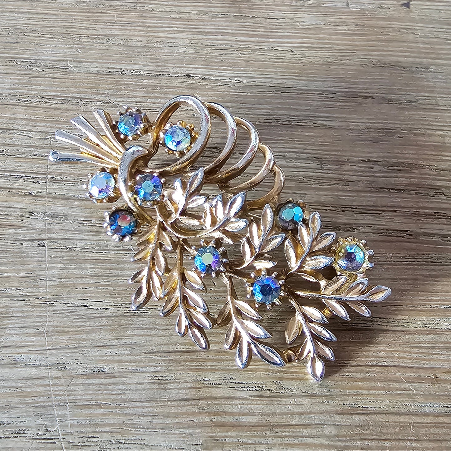 1960s copper-tone floral spray brooch with Aurora Borealis rhinestones
