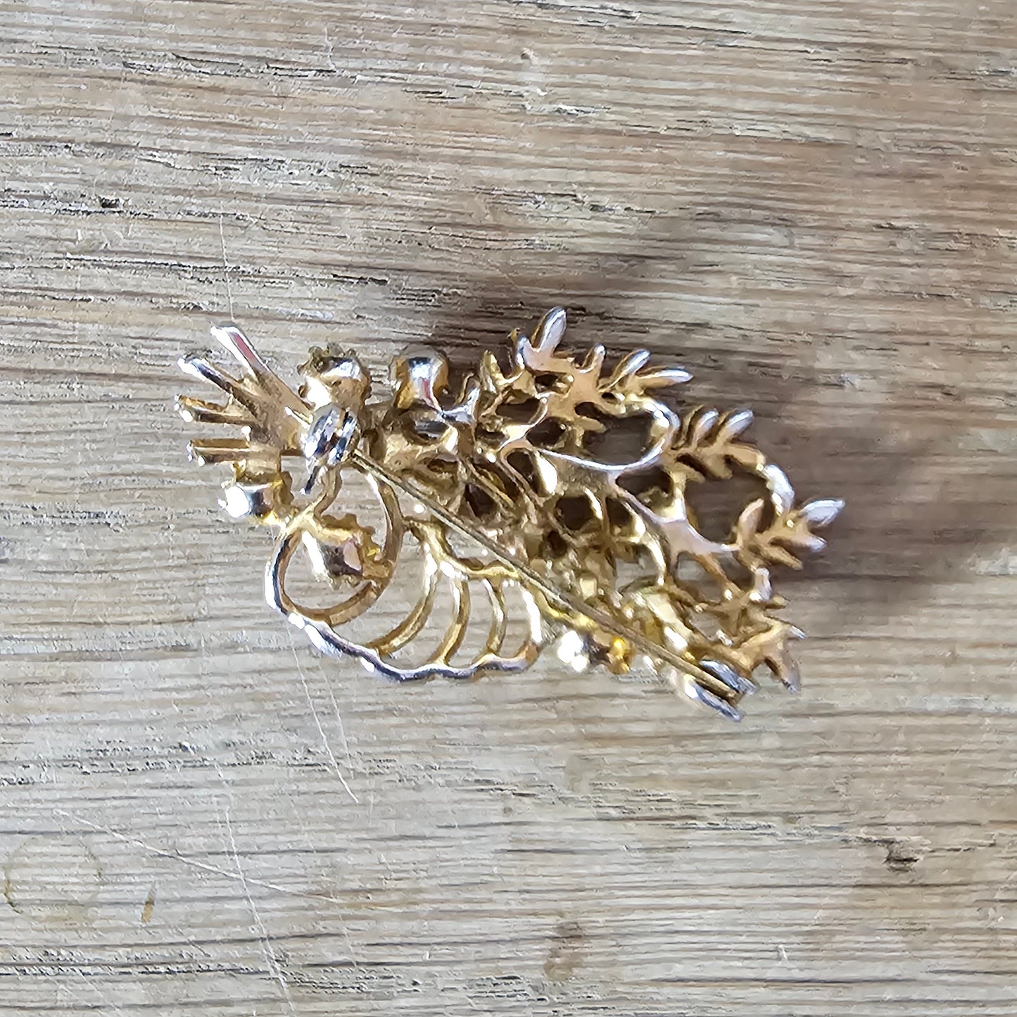 1960s copper-tone floral spray brooch with Aurora Borealis rhinestones