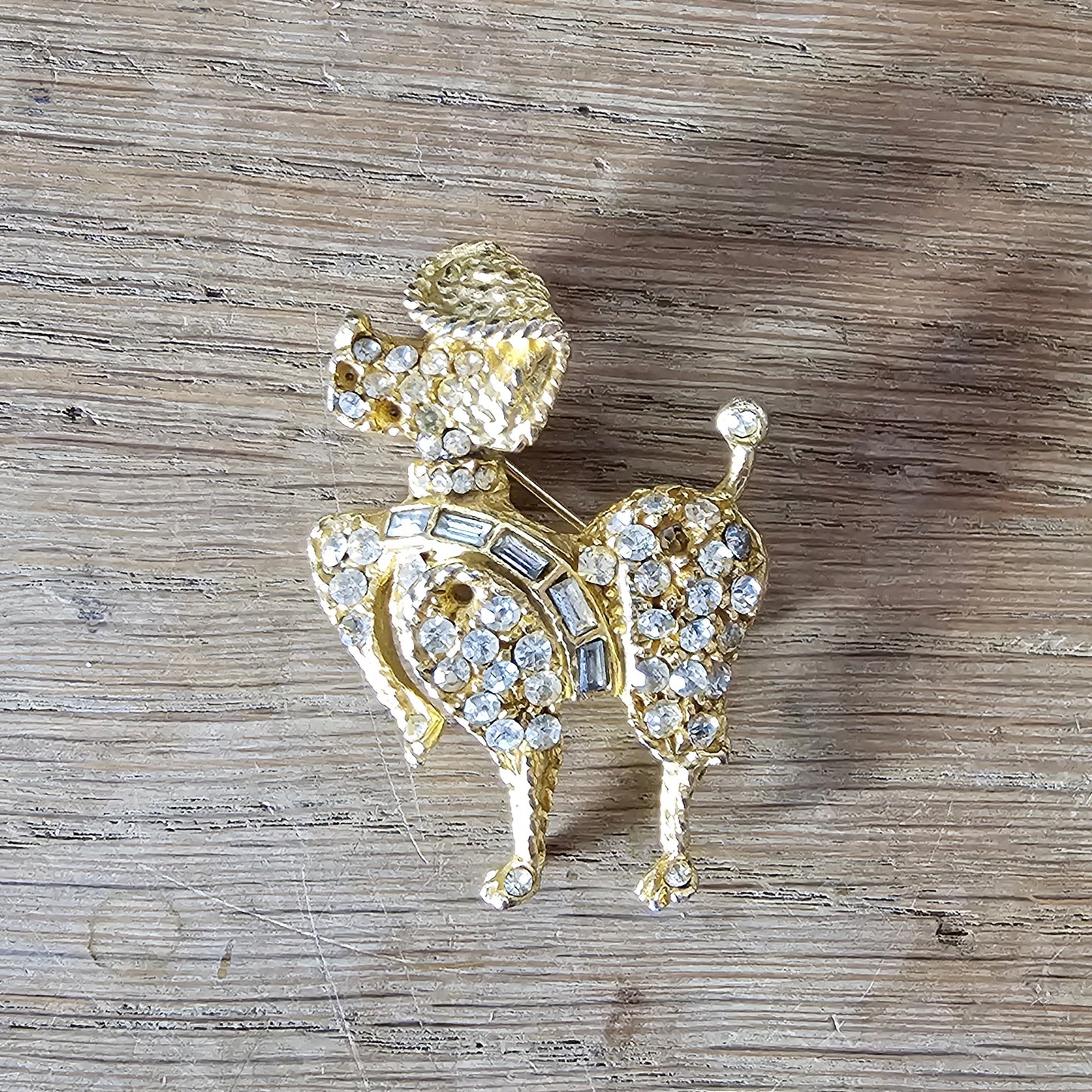1960s gold-tone & rhinestone prancing French Poodle figural dog brooch