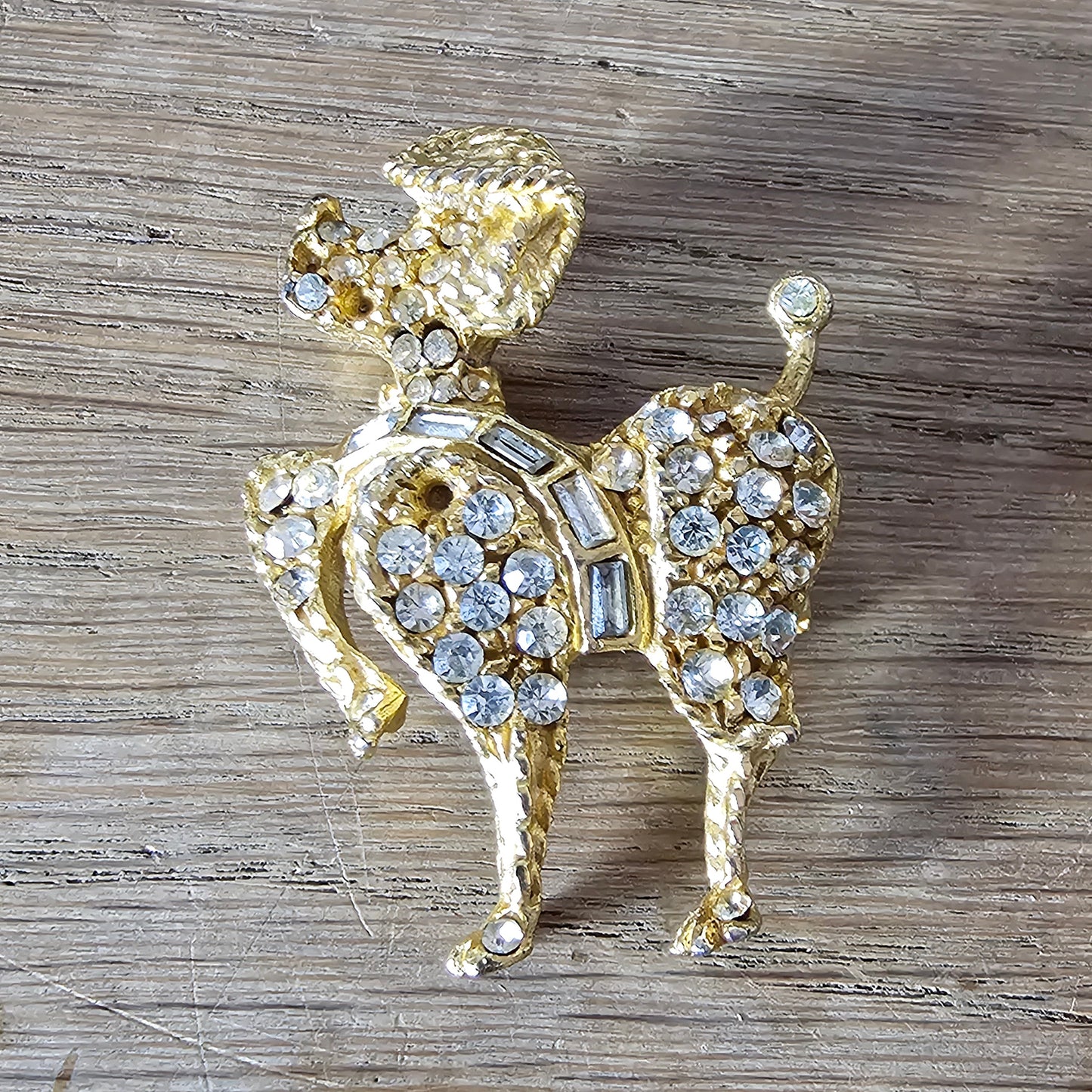 1960s gold-tone & rhinestone prancing French Poodle figural dog brooch