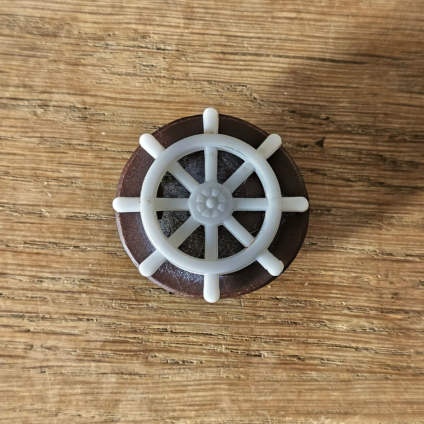 Home-made brooch using vintage plastic ships wheel and vintage wooden round bead