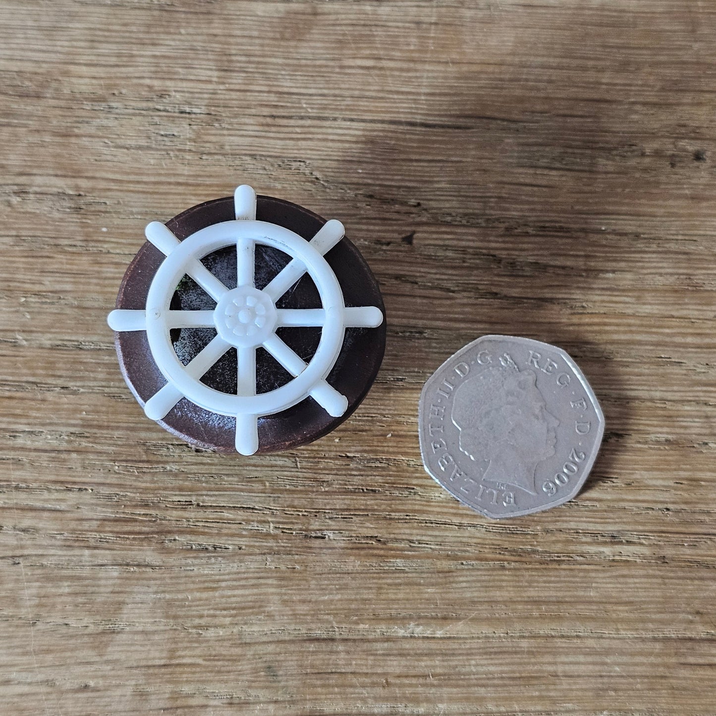 Home-made brooch using vintage plastic ships wheel and vintage wooden round bead