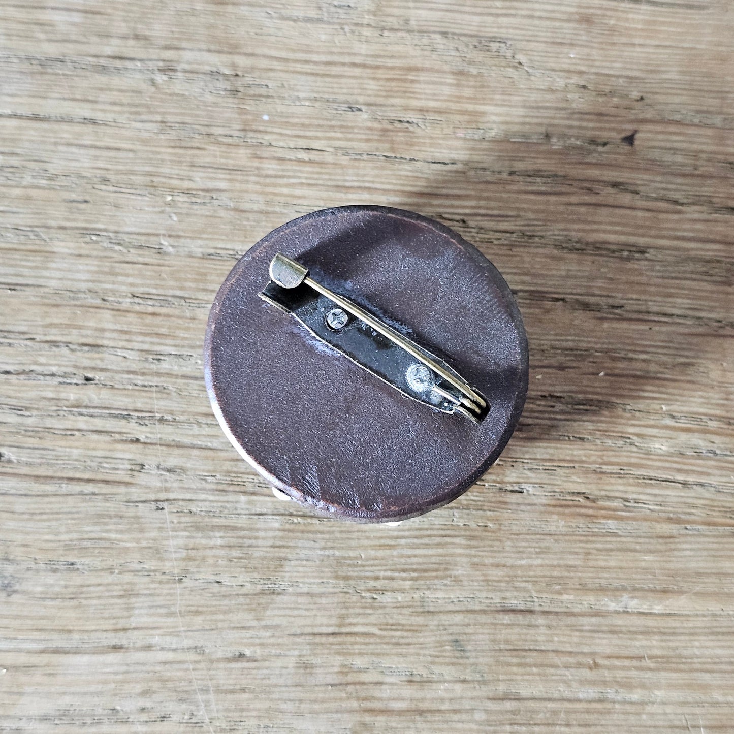 Home-made brooch using vintage plastic ships wheel and vintage wooden round bead