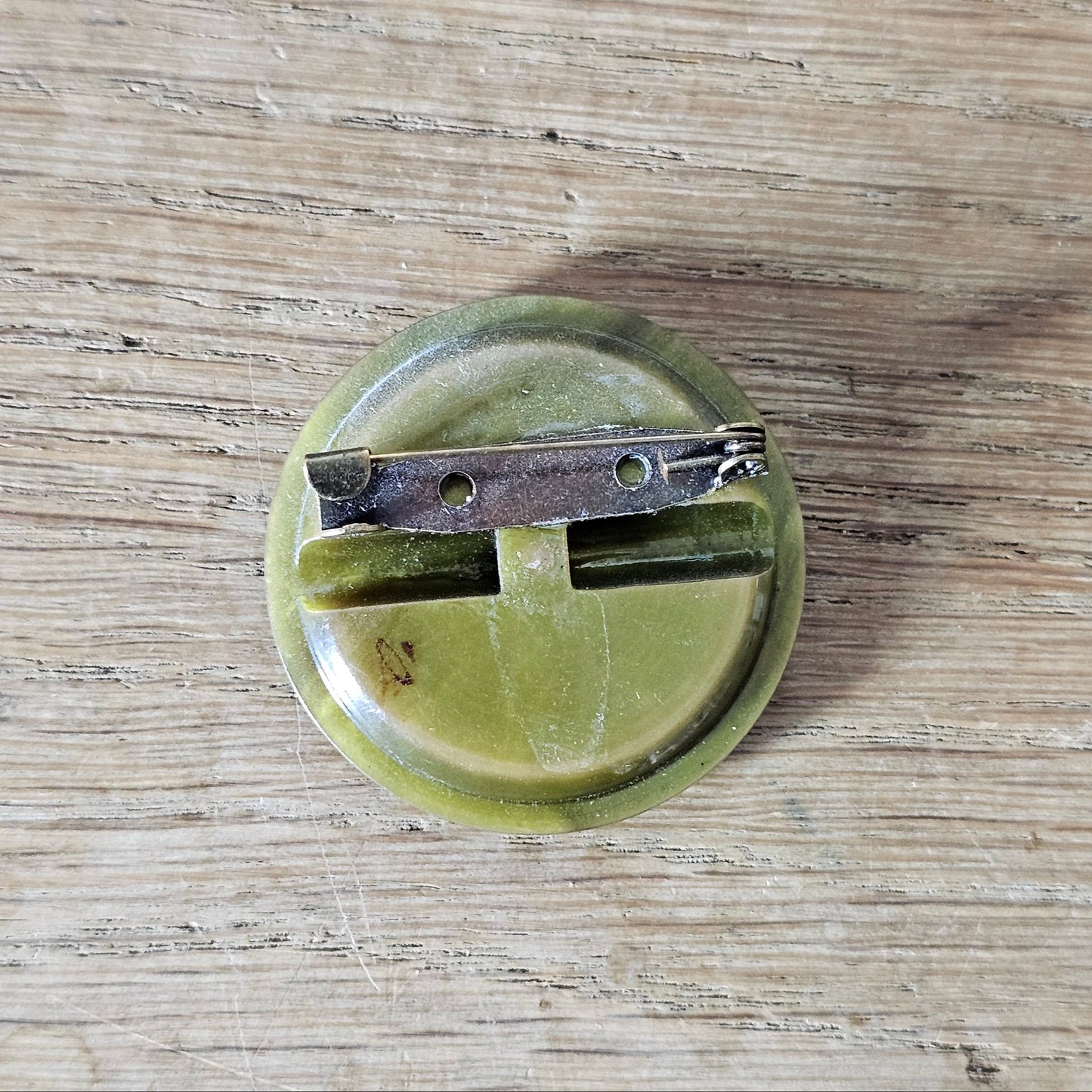 Handmade brooch using vintage olive green carved lucite button