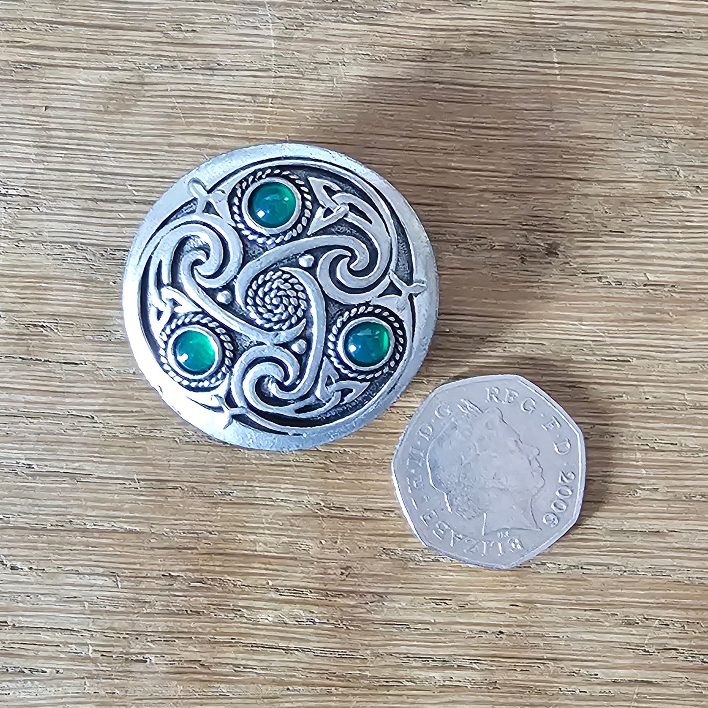 1980s Celtic pewter knotwork brooch with green glass cabochons