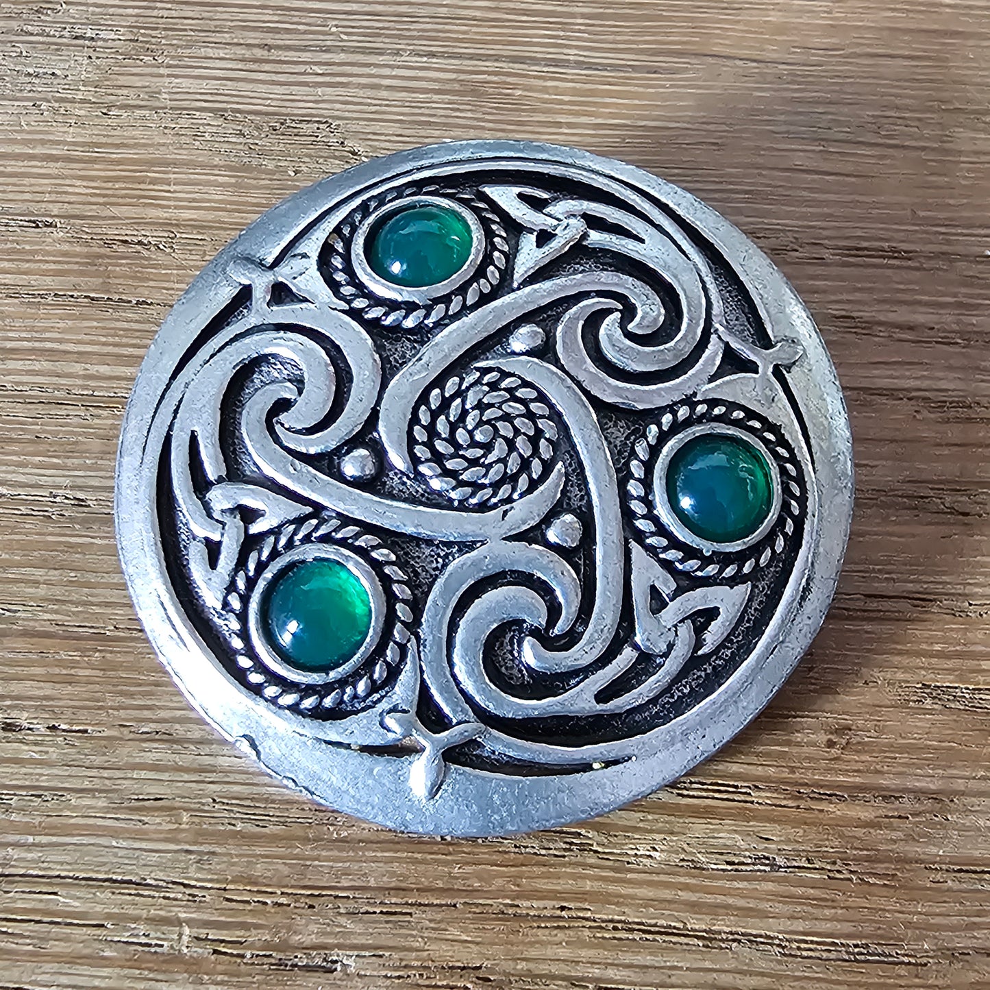 1980s Celtic pewter knotwork brooch with green glass cabochons