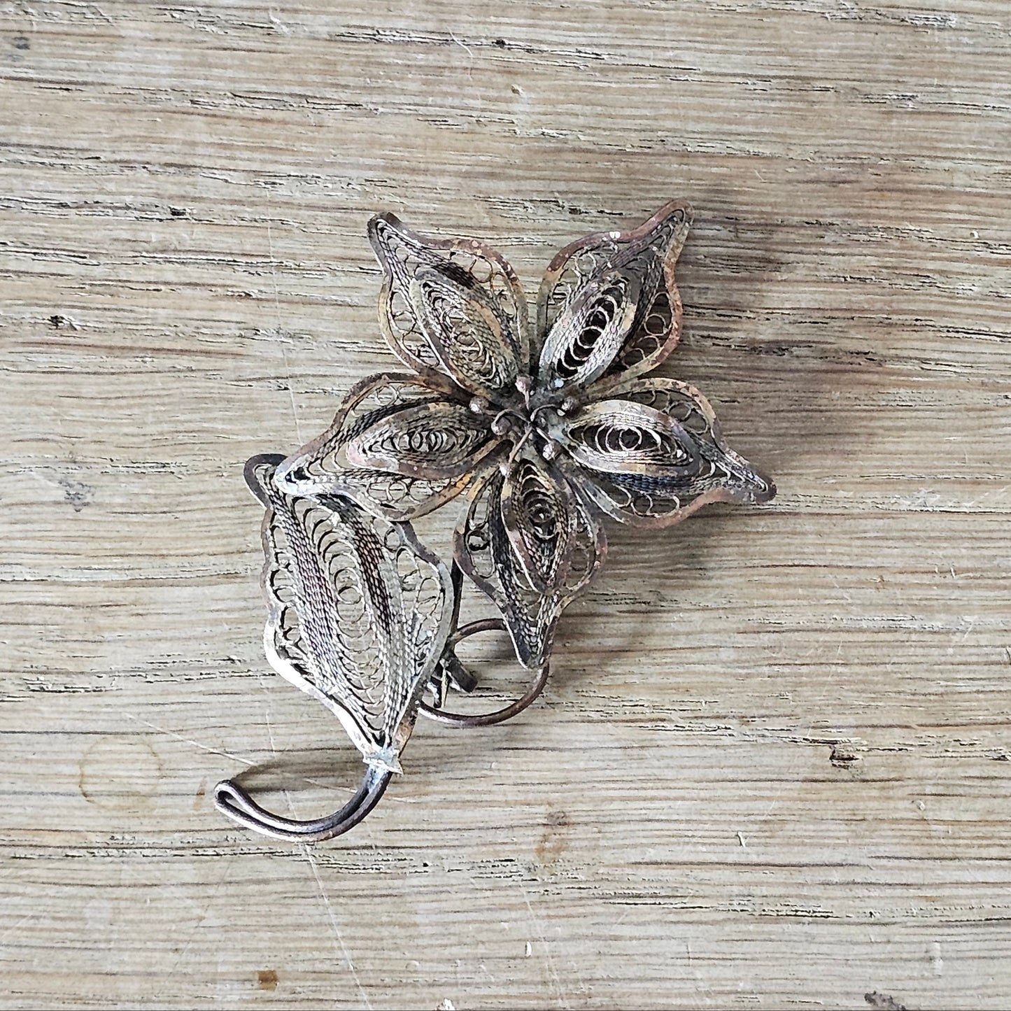 Antique copper filigree floral brooch