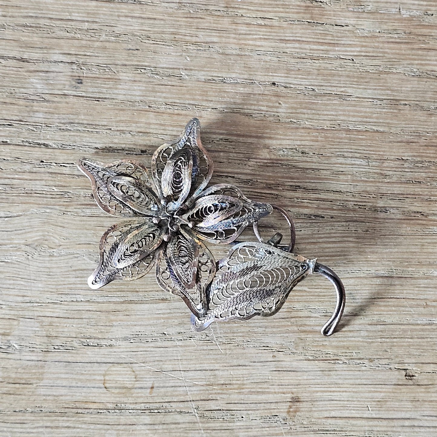Antique copper filigree floral brooch