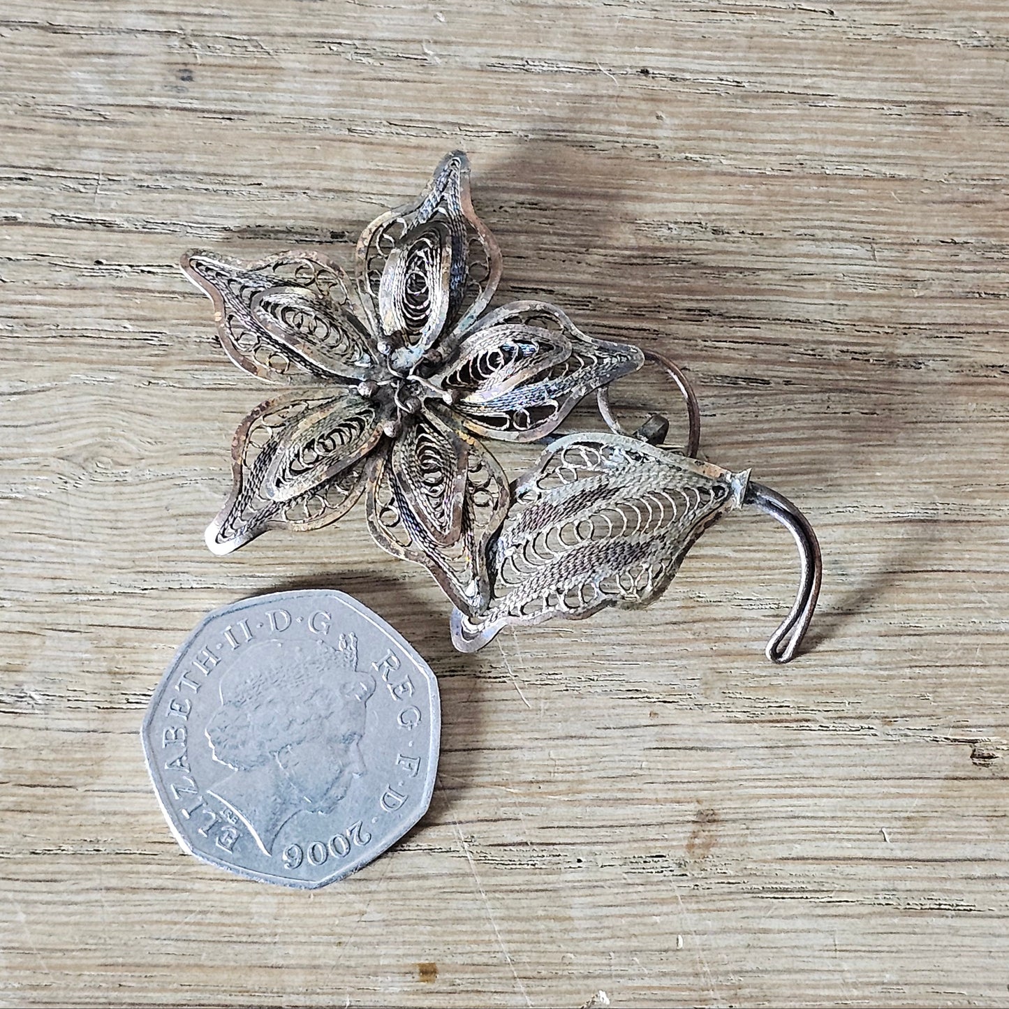 Antique copper filigree floral brooch