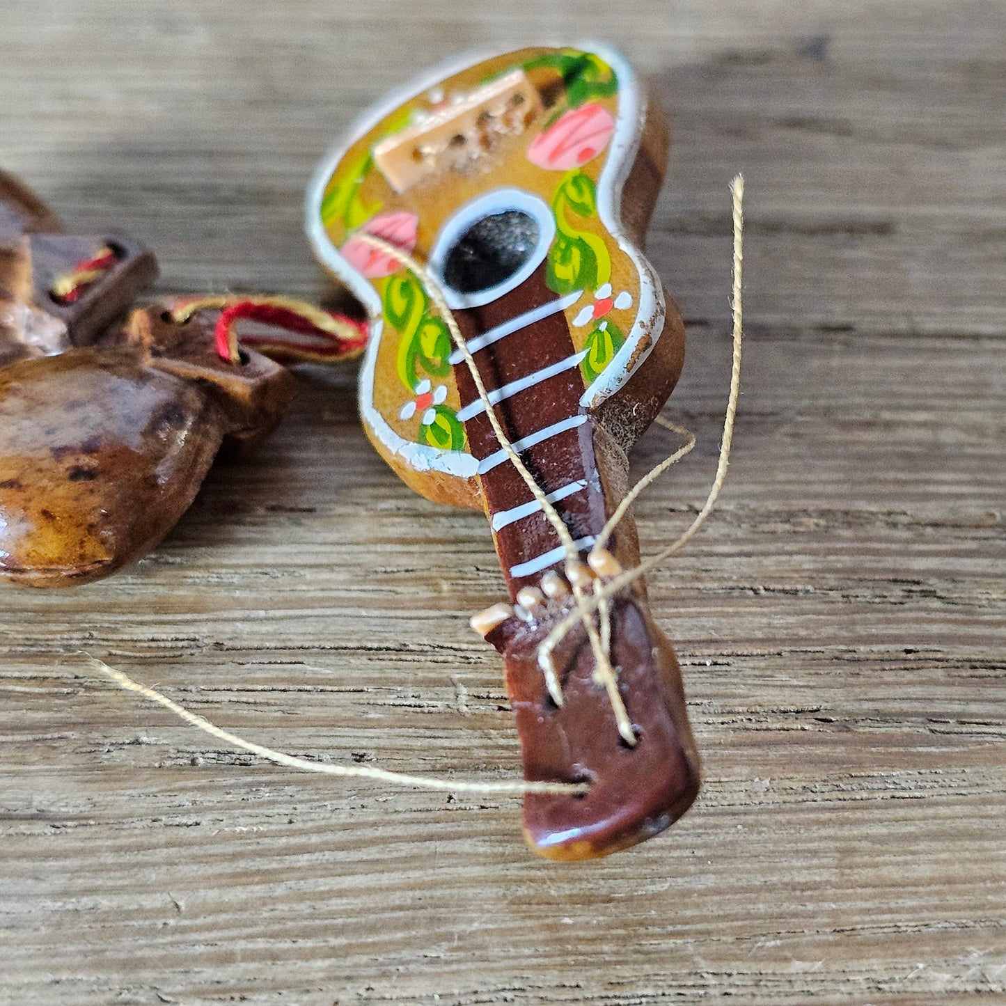 1940s hand-painted wooden guitar brooch with hanging maracas