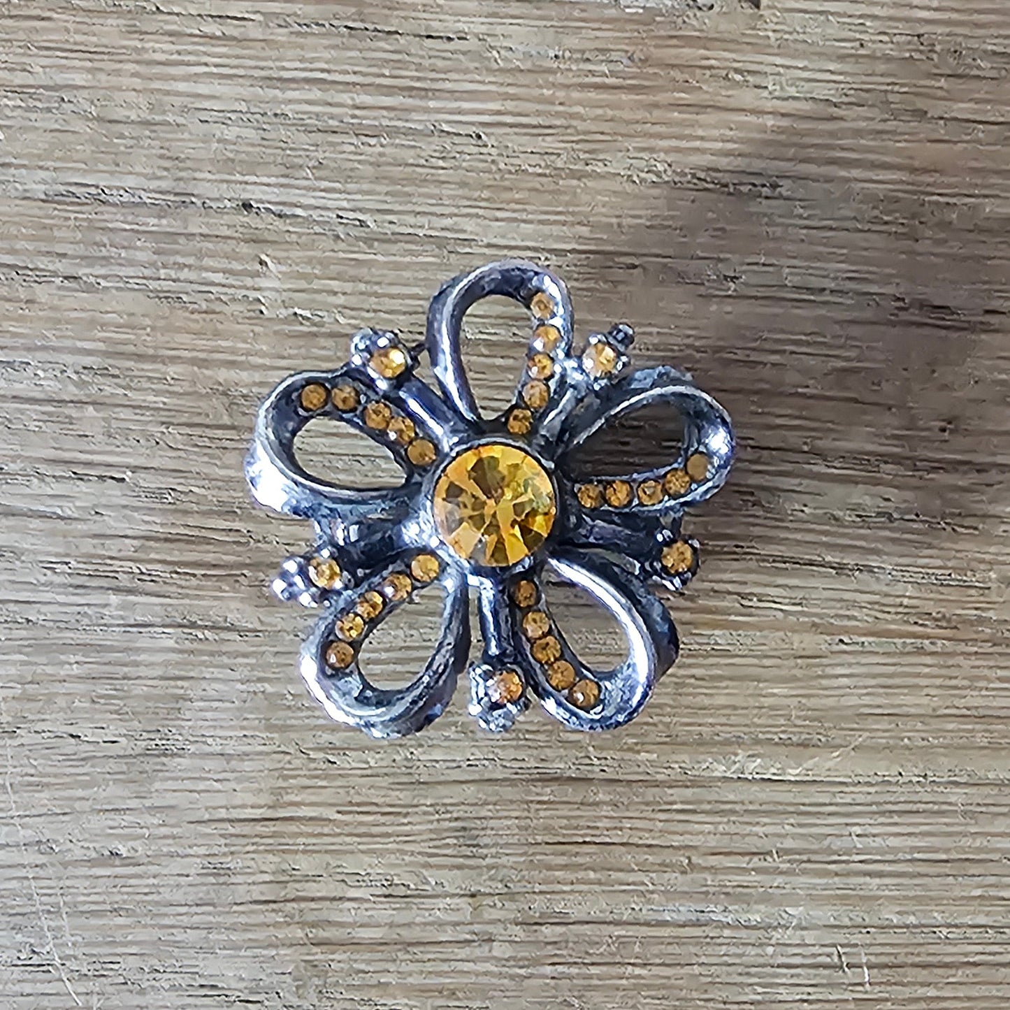 1960s silver-tone amber rhinestone flower brooch