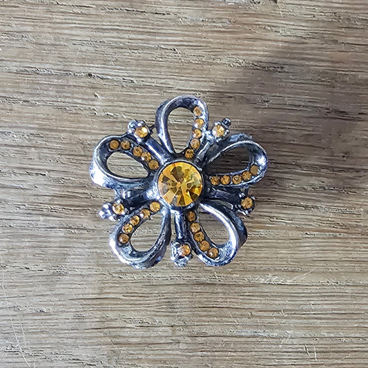 1960s silver-tone amber rhinestone flower brooch