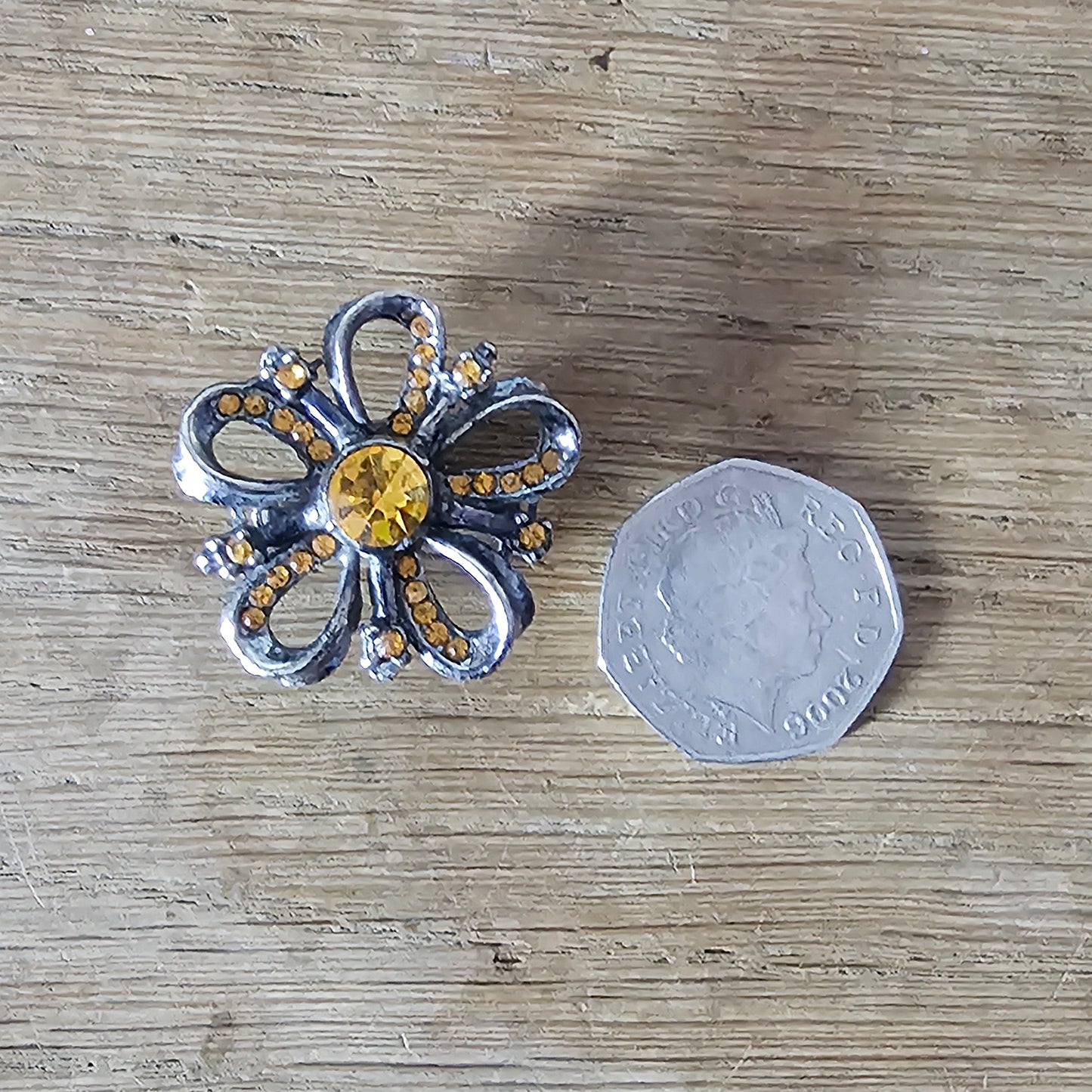 1960s silver-tone amber rhinestone flower brooch