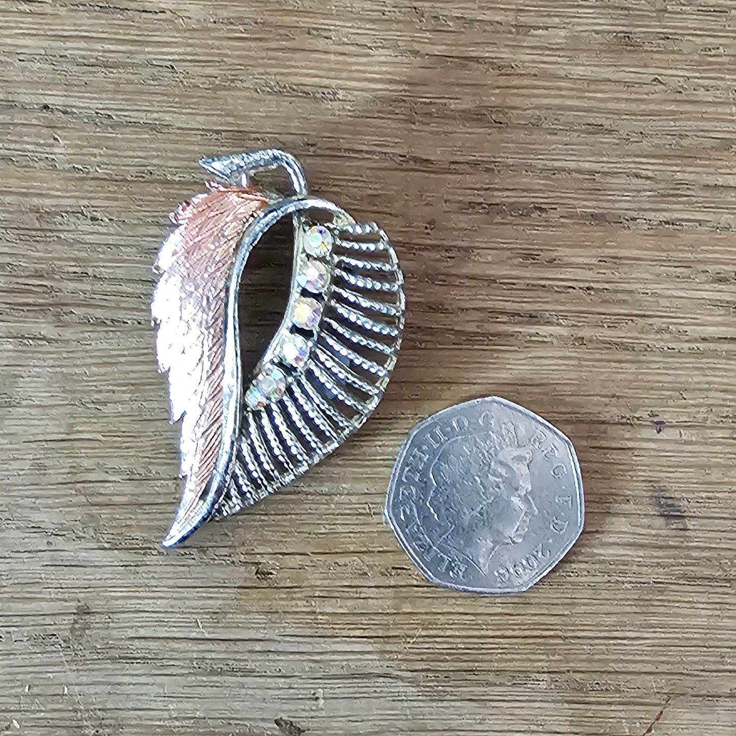 1960s pink enamel & Aurora Borealis rhinestone feather brooch