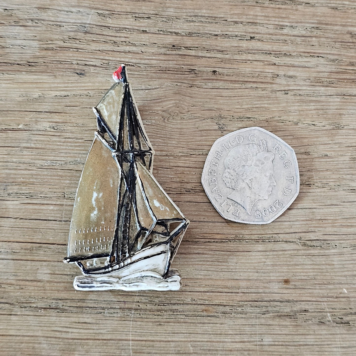 1930s/40s handpainted celluloid sailing boat brooch, made in England