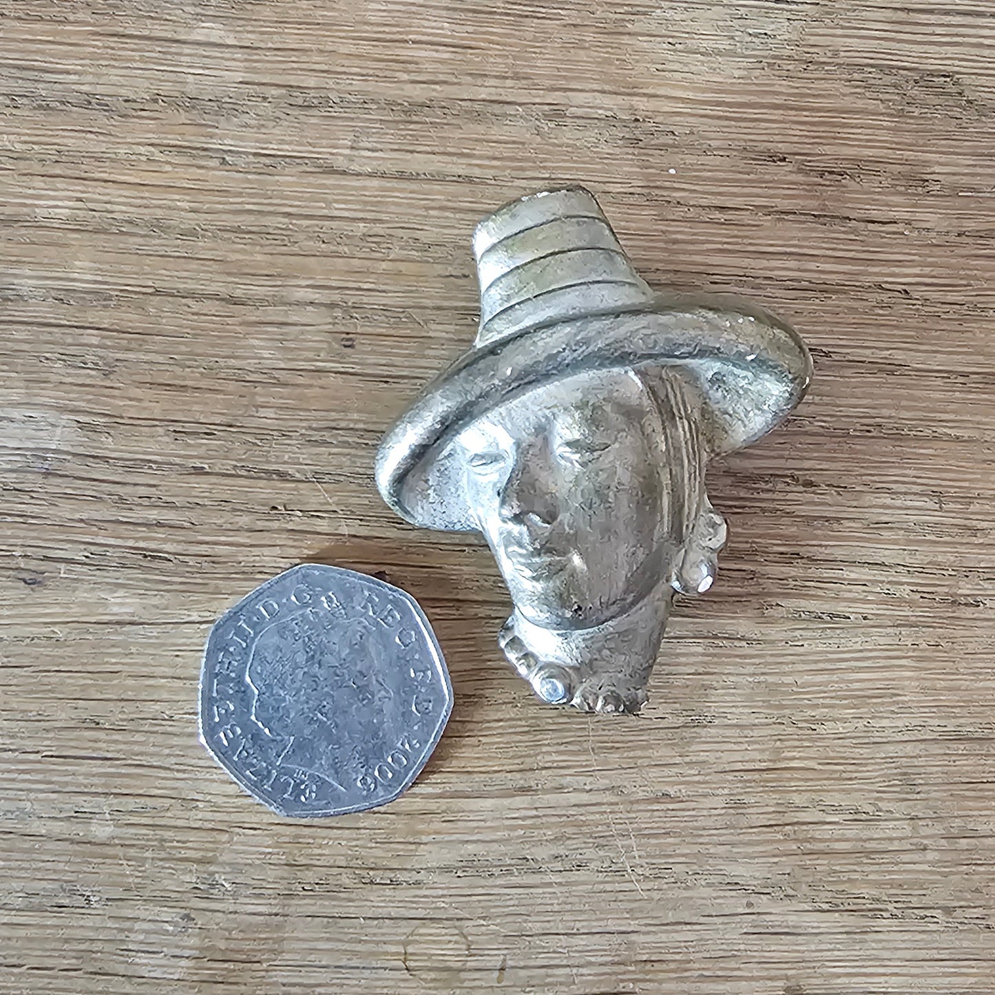 circa. 1940s gold-painted plaster/chalkware lady in hat head brooch